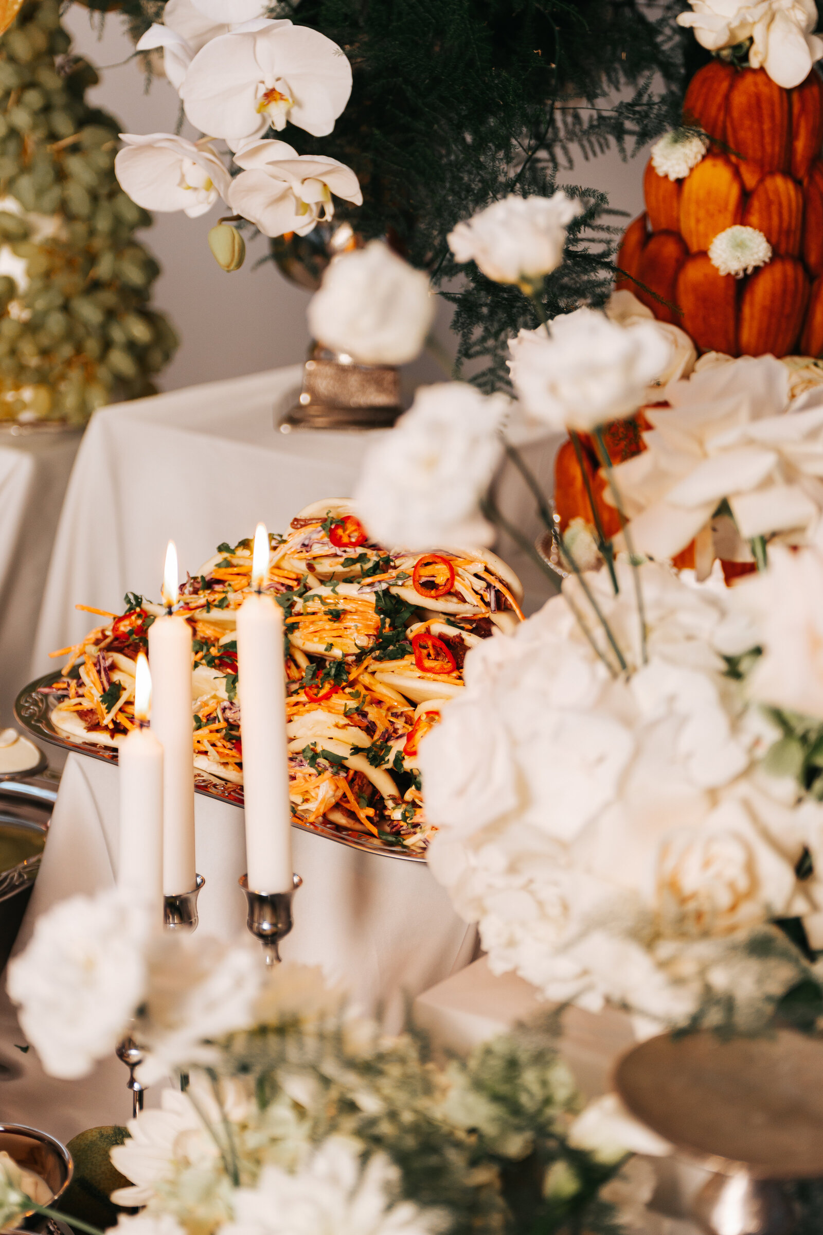 Nouré & Co wedding grazing table with candles and flowers