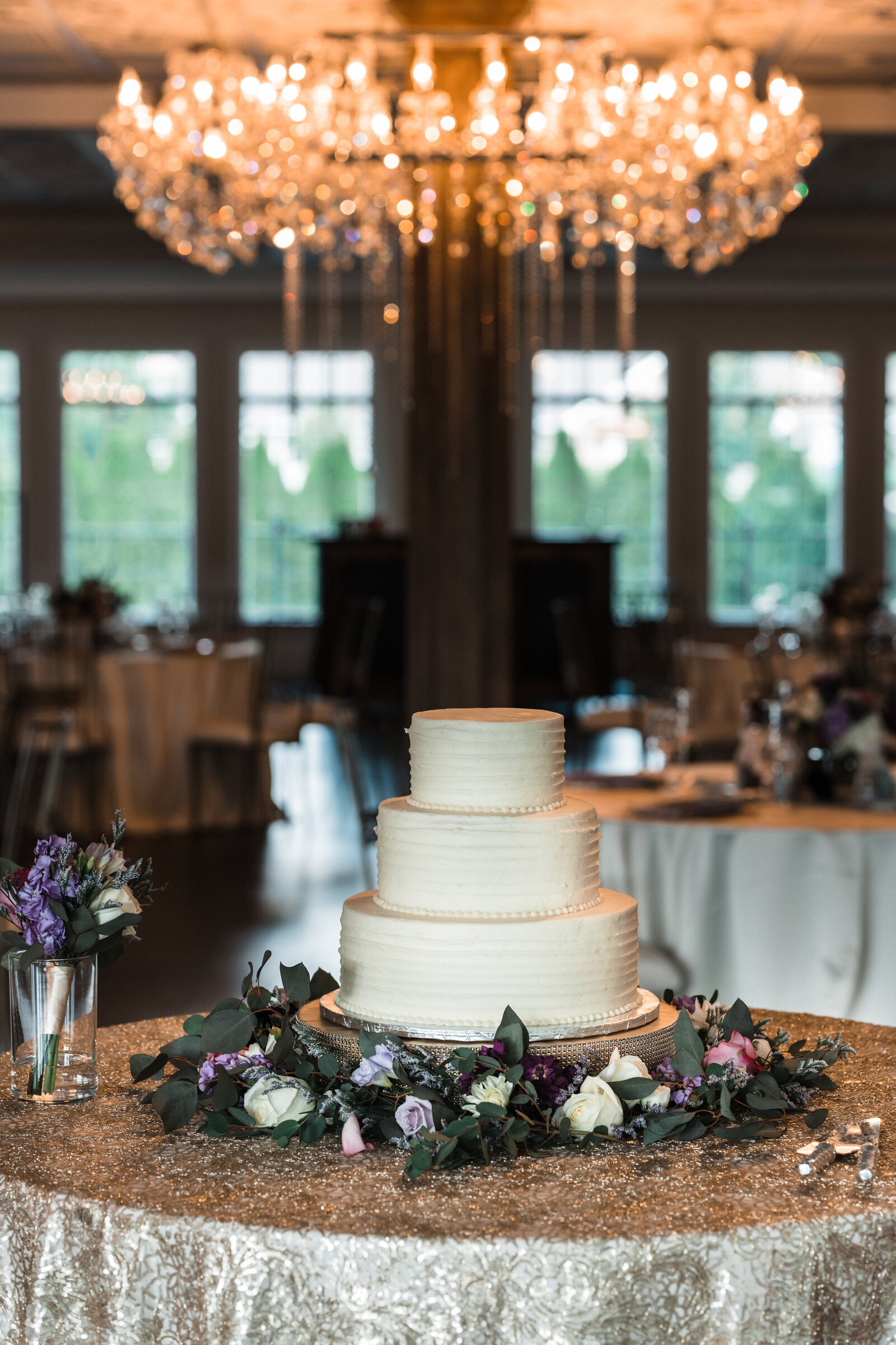 A simple white wedding cake at Black Iris Estate in Carmel Indiana