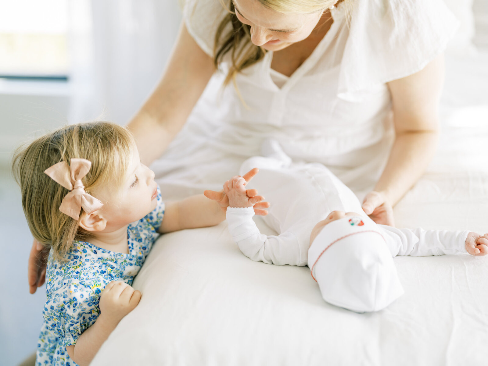 in studio lifestyle newborn session with toddler