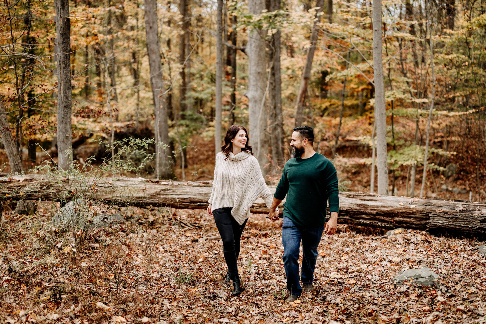 engaged couple fall woods