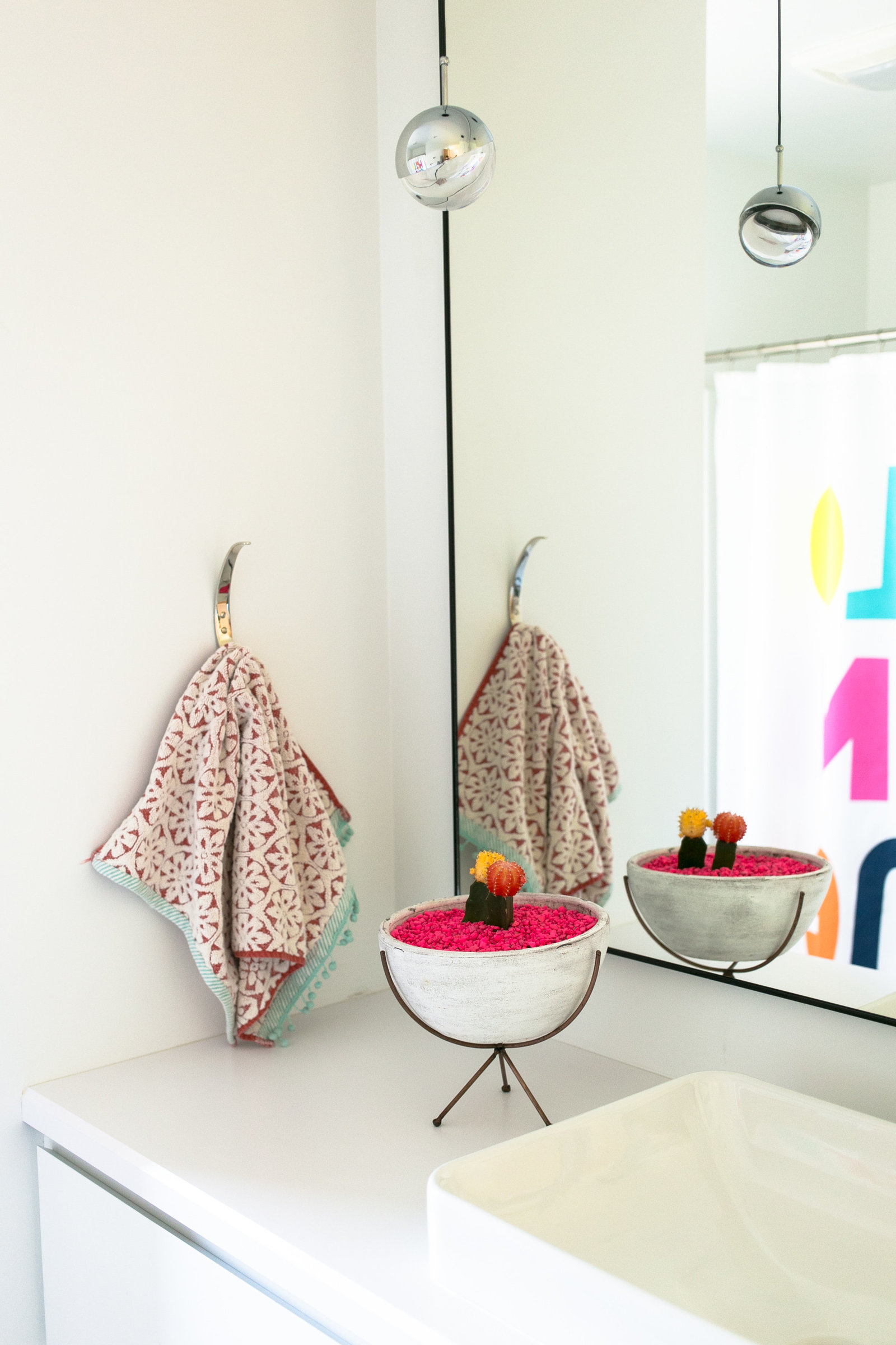 Minimalist and  gender neutral kids bathroom with fun pops of color