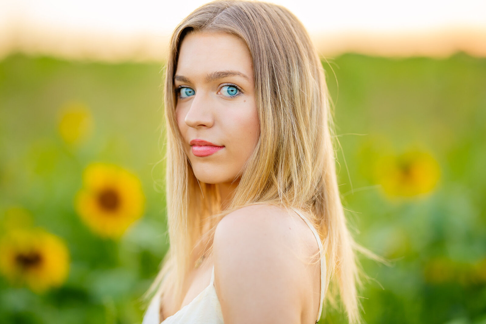 close up of senior in the sunflower field in St. Louis MO