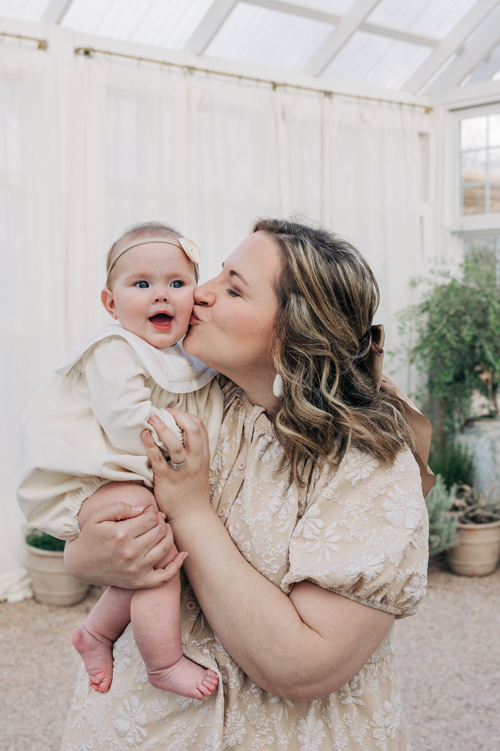 Mom-kissing-baby-Fleurish-Greenhouse