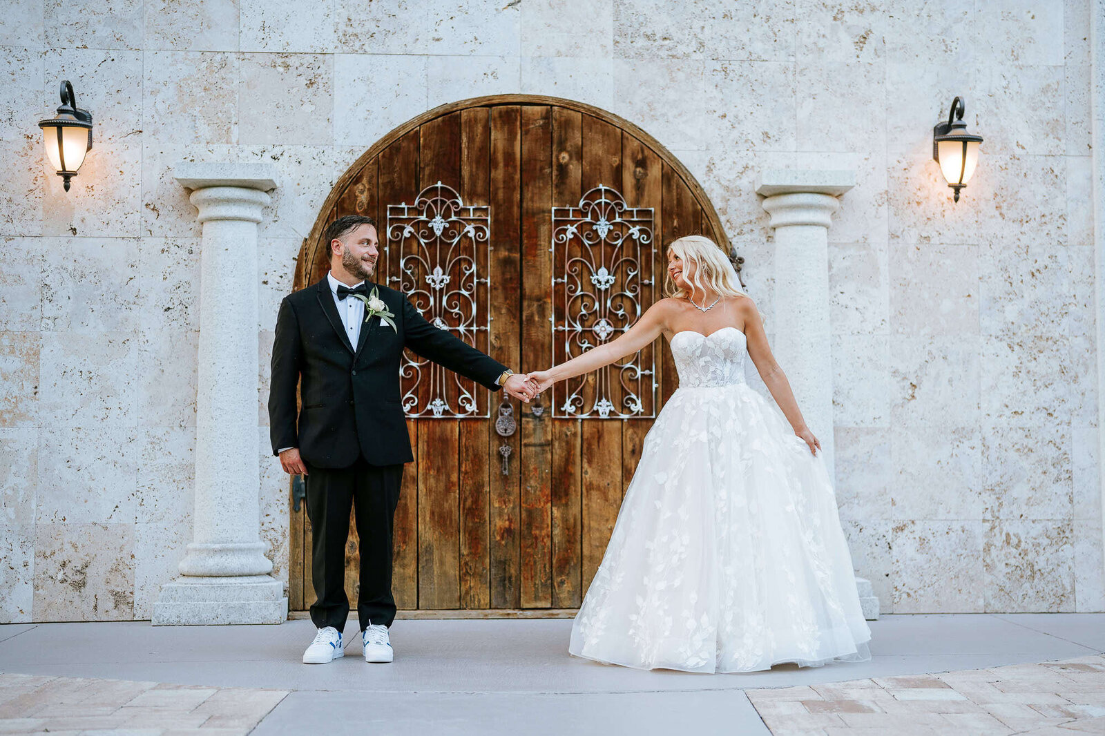 Couple portrait in front of the famous oak doors at Bakers Ranch