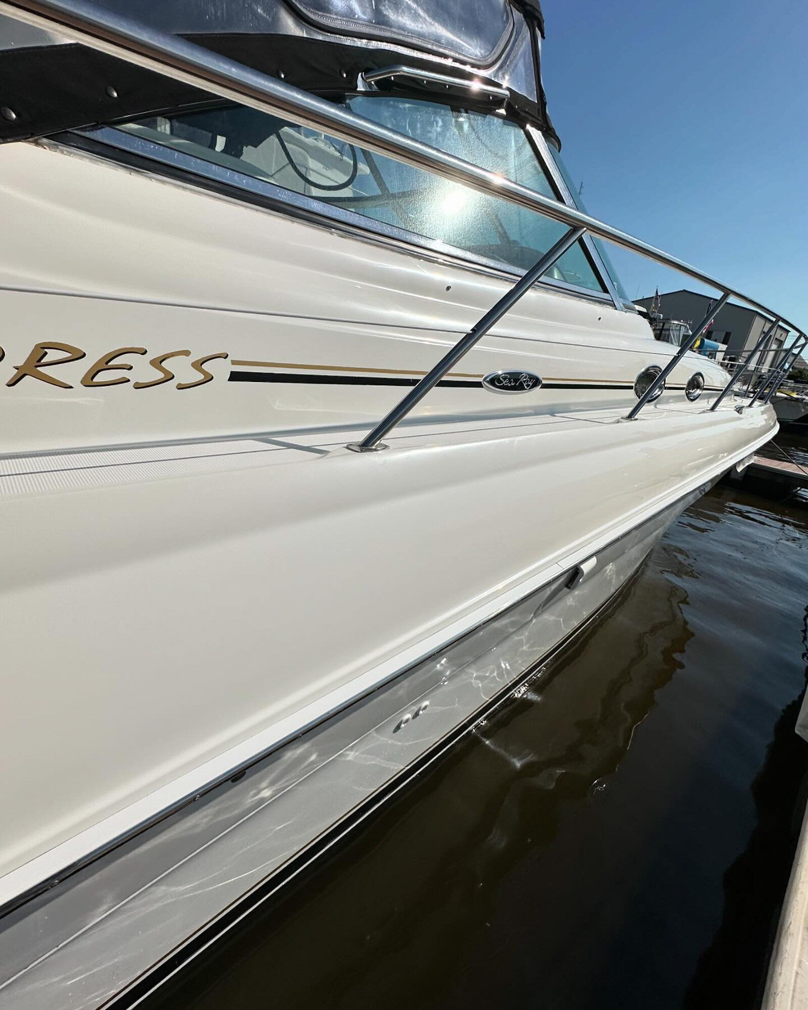 Glossy side of a boat after detailing services