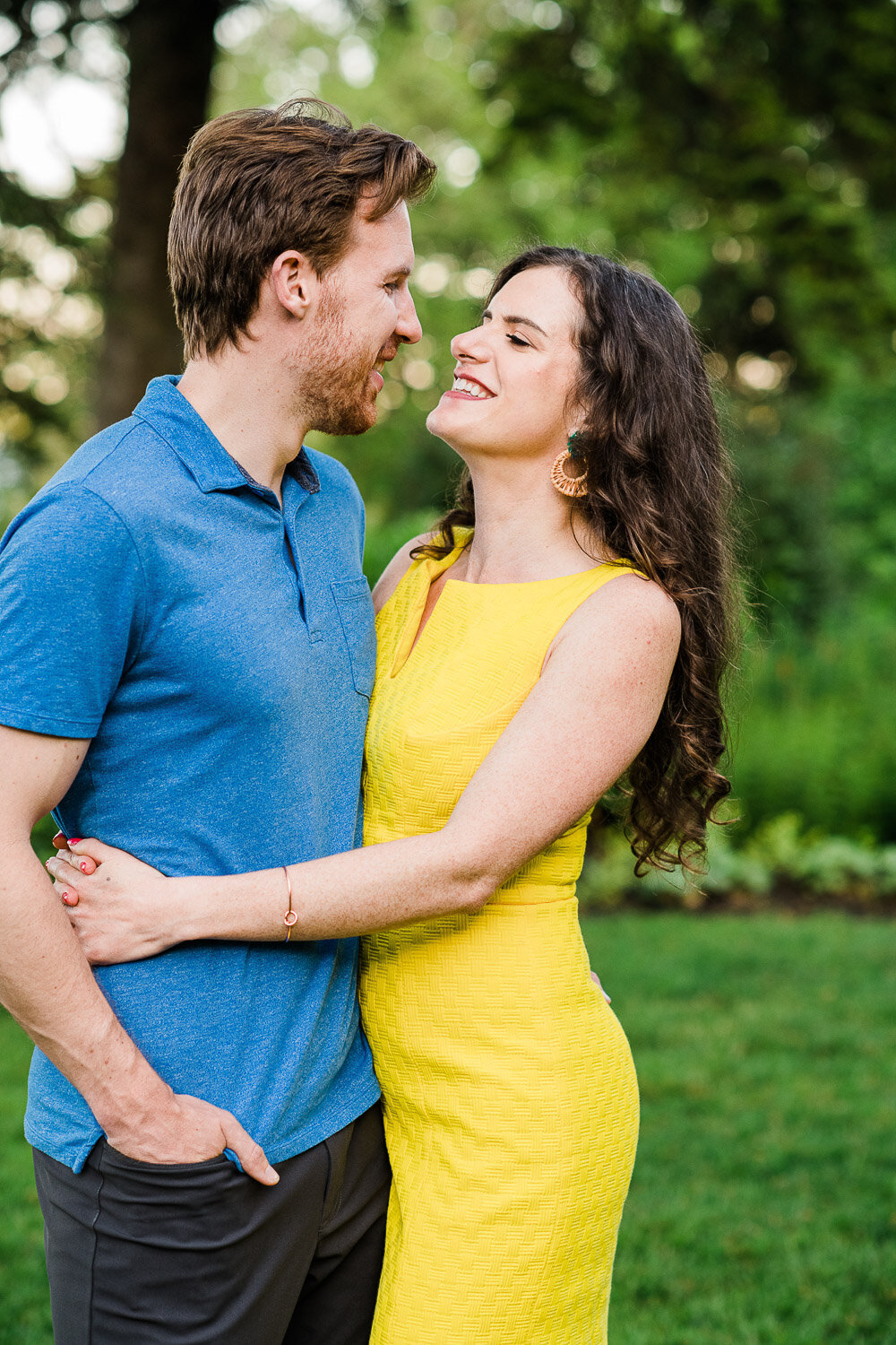 couple hug and face each other in garden