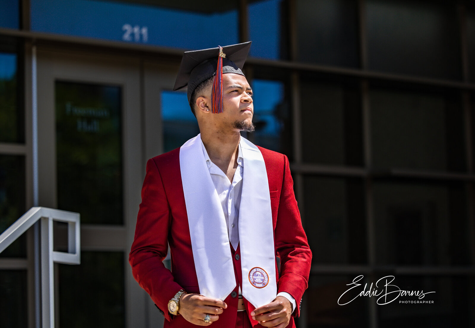 Senior in suit on steps
