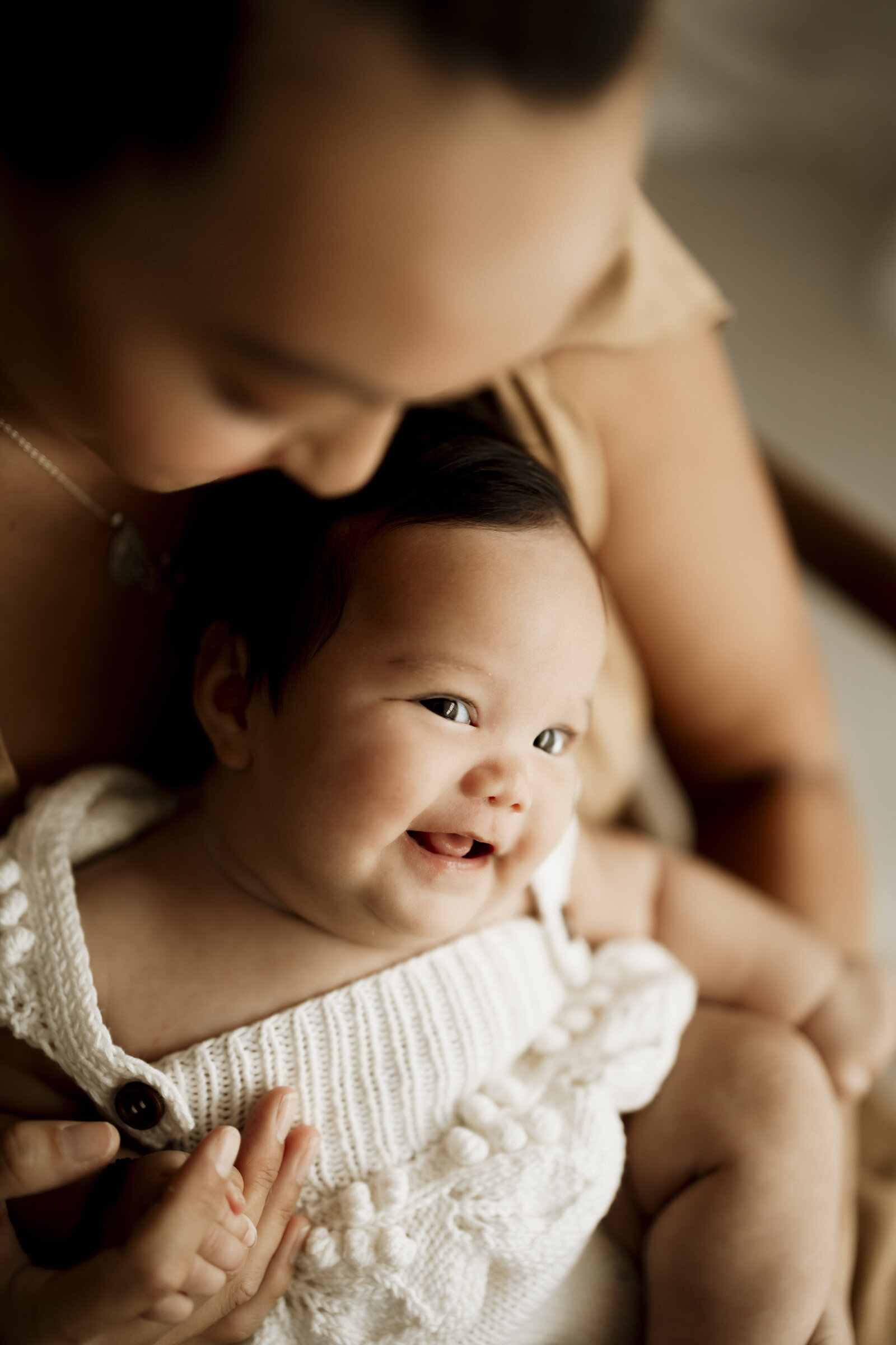 Candid newborn family photography in a Perth studio – relaxed, emotional, and full of love.