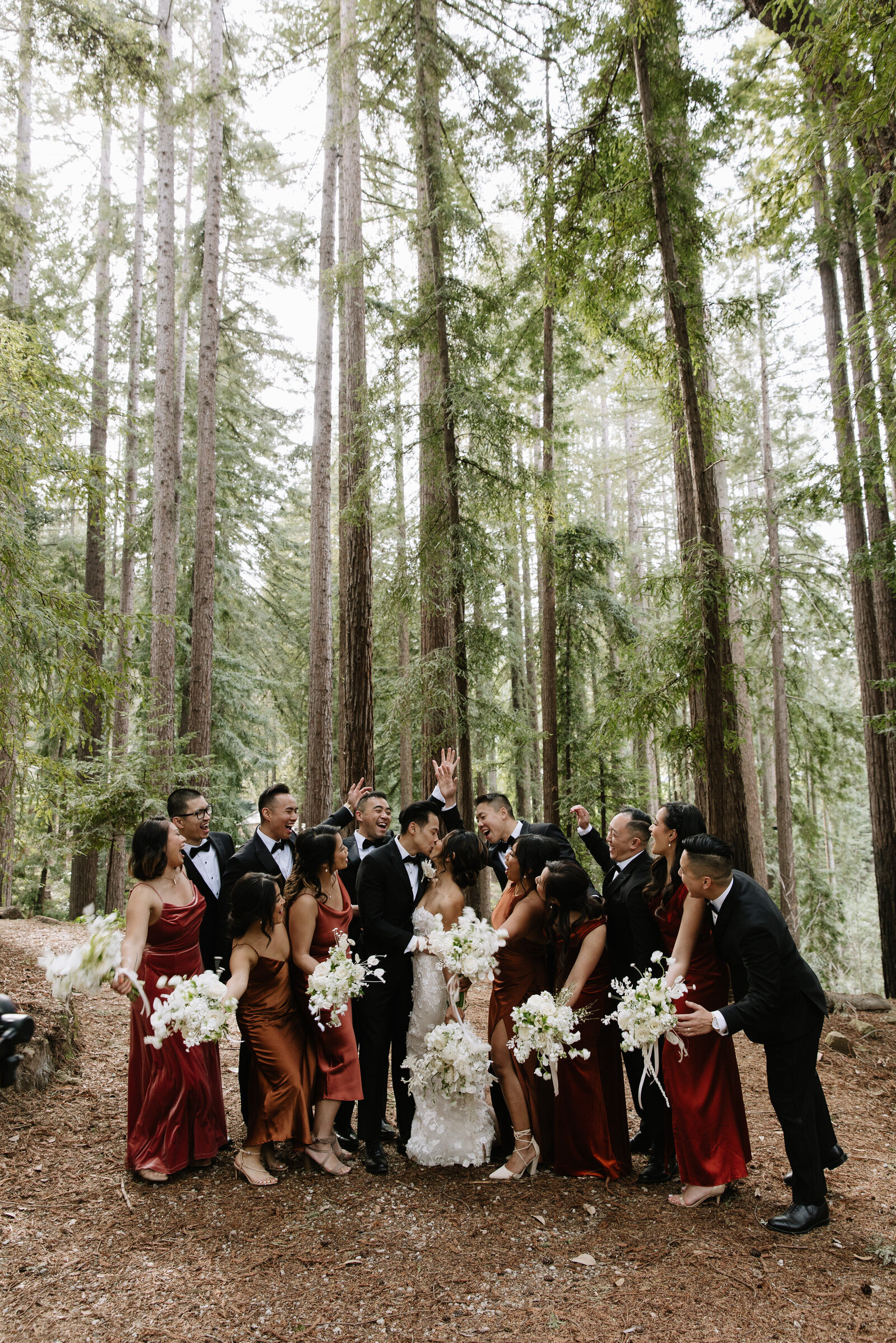 Bridal party celebrates while couple kisses after Olympia wedding ceremony in Washington