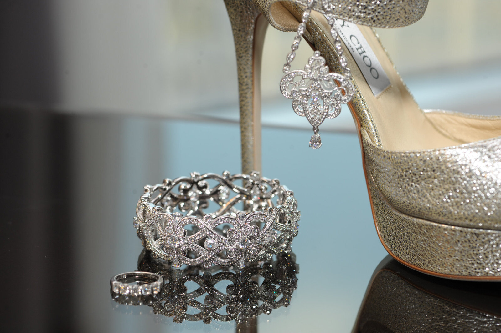 Bride's silver wedding heels and ring