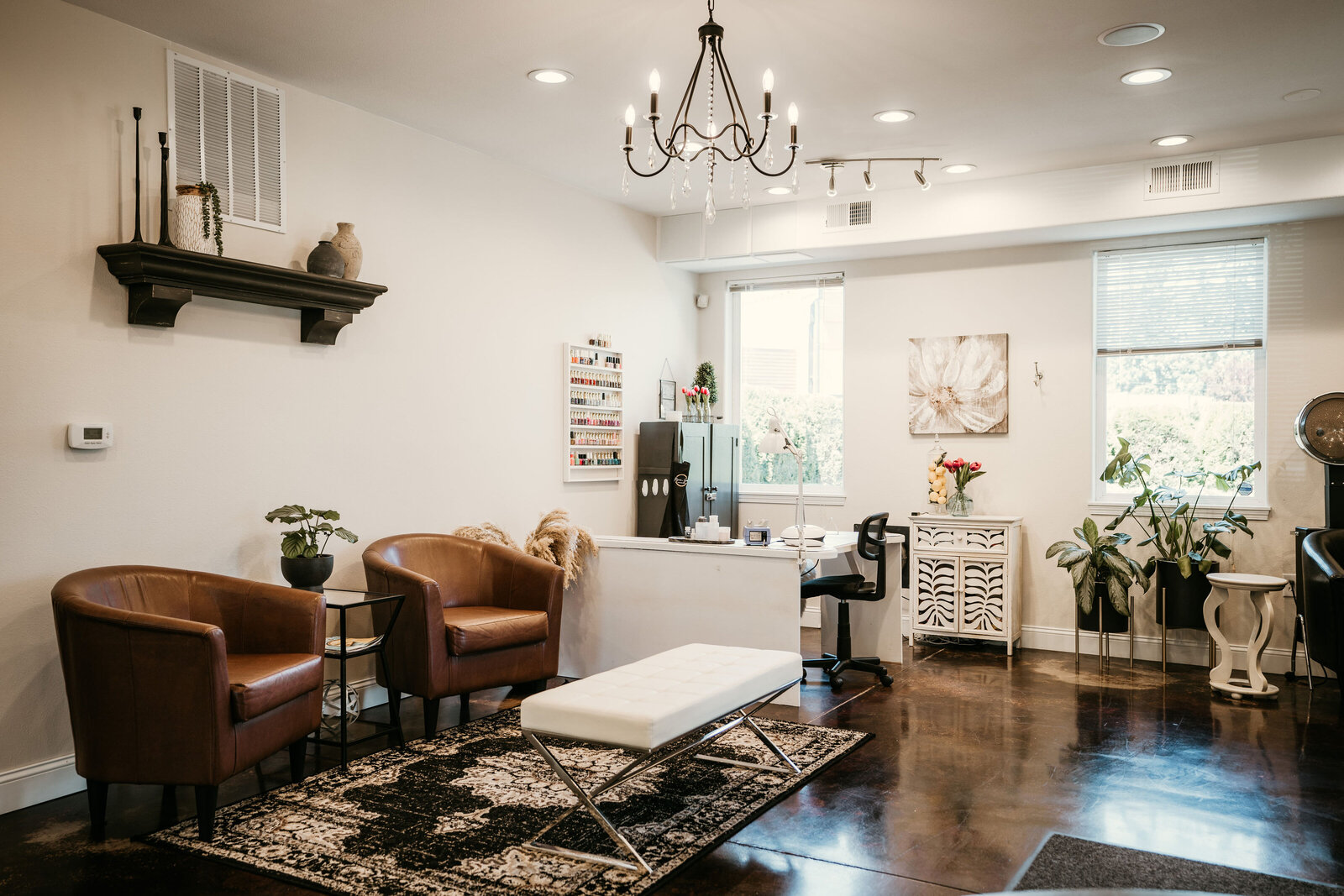 Nails at Maven + Grace Salon in McMinnville, Oregon, with dark shiplap wall and curated product shelves
