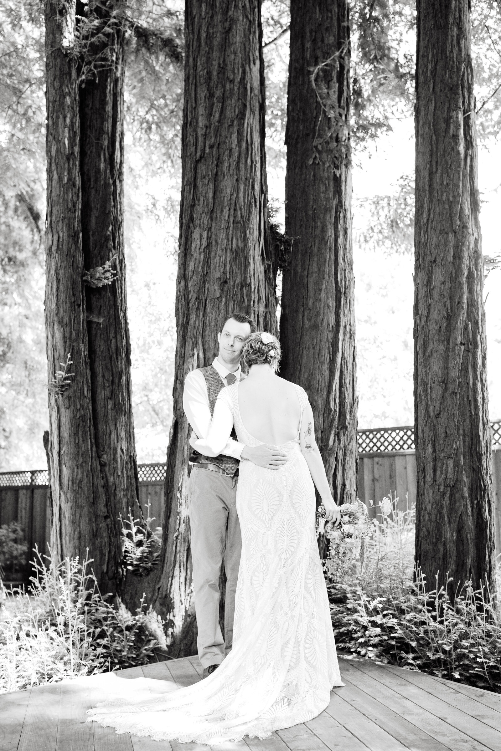 Bride and groom on their colorful wedding day in Santa Cruz, California in the redwood trees.