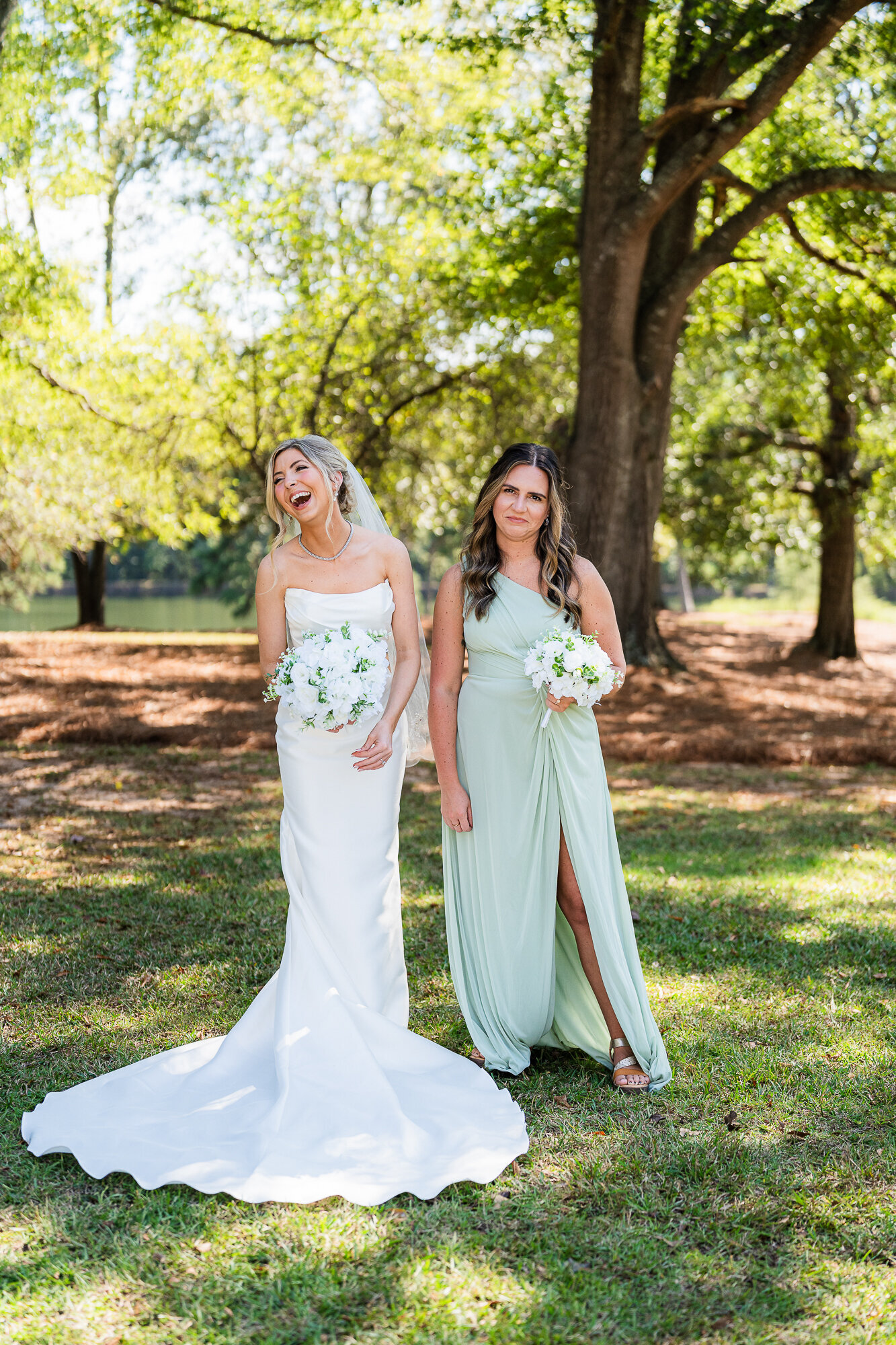 bride and her maid of honor having a goofy moment at the wedding venue at Daisy Hill