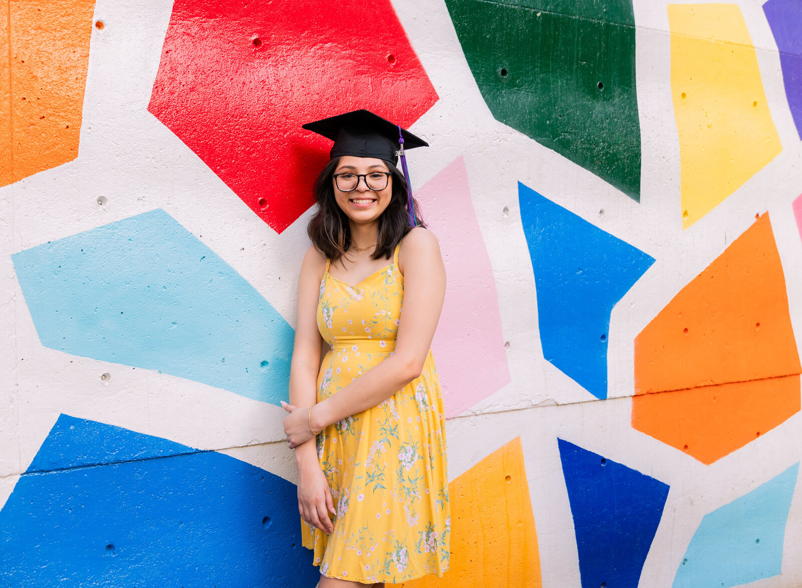 senior girl cap with colorful mural