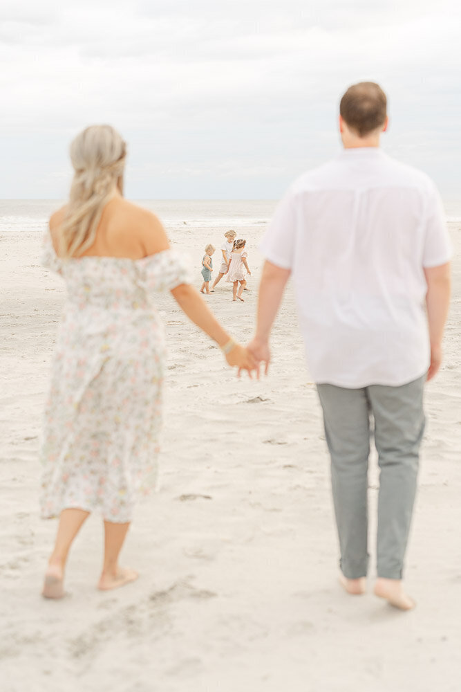 parents looking at their kids during their VA Beach, Virginia family picture