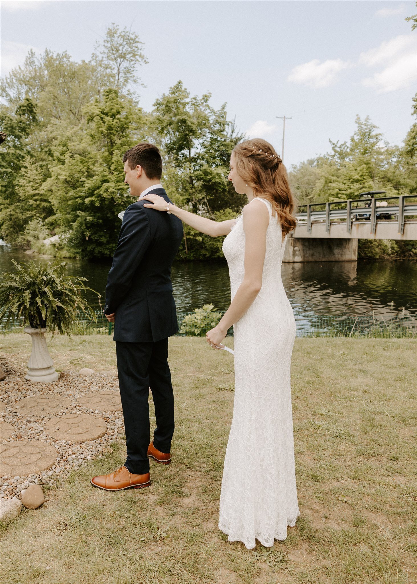 bride standing behind groom touching his shoulder3
