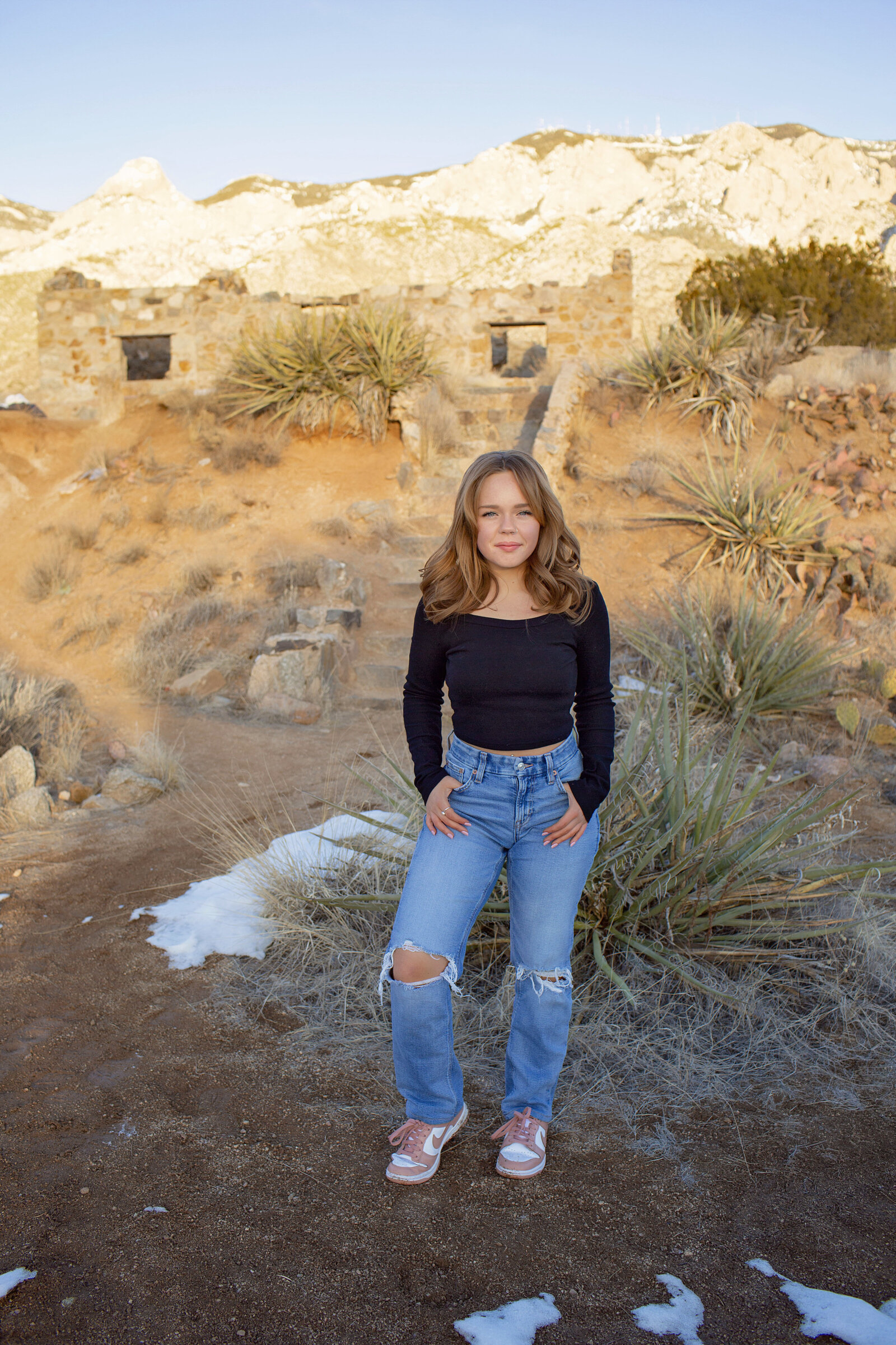 NM-Senior-Girl-and-sunset-mountains-brick-house