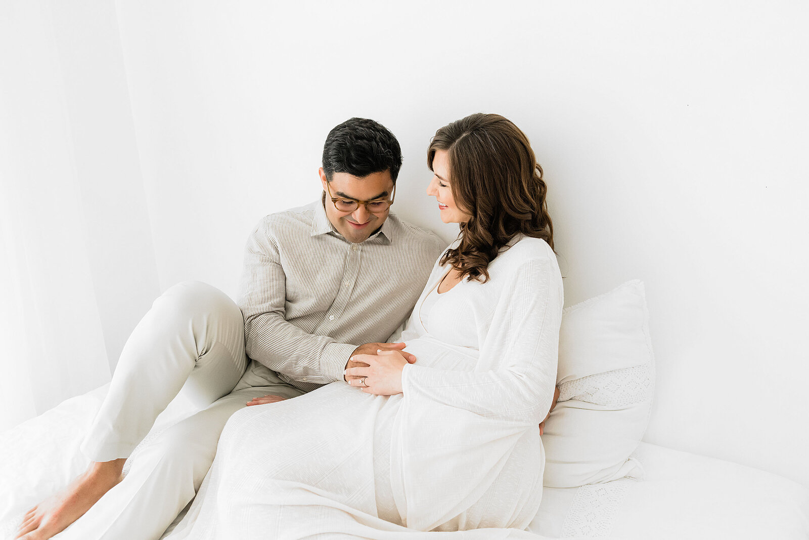 a pregnant couple during their maternity session in Destin Florida