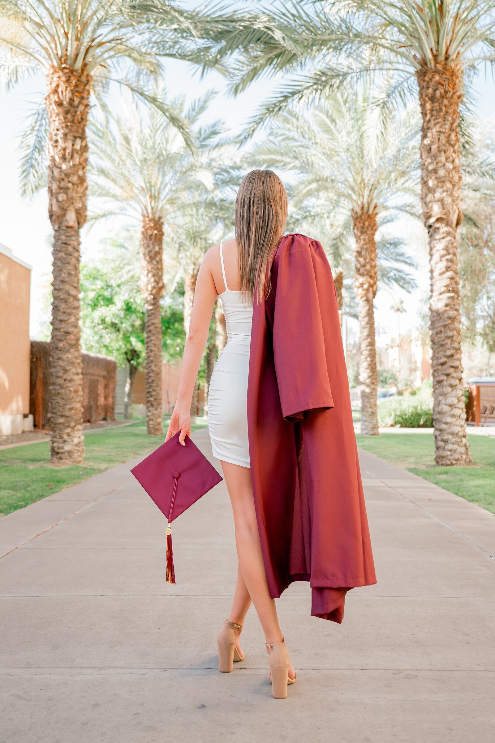 senior girl at palm walk at ASU posing for senior photos 