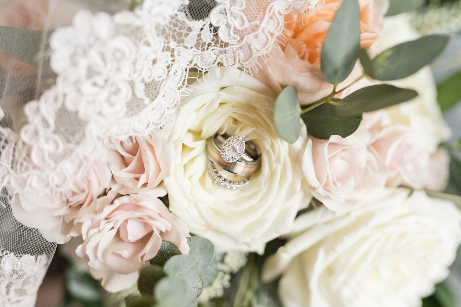 engagement ring sitting in bridal bouquet photographed by Kaitlin Mendoza Photography, an Indianapolis wedding photographer