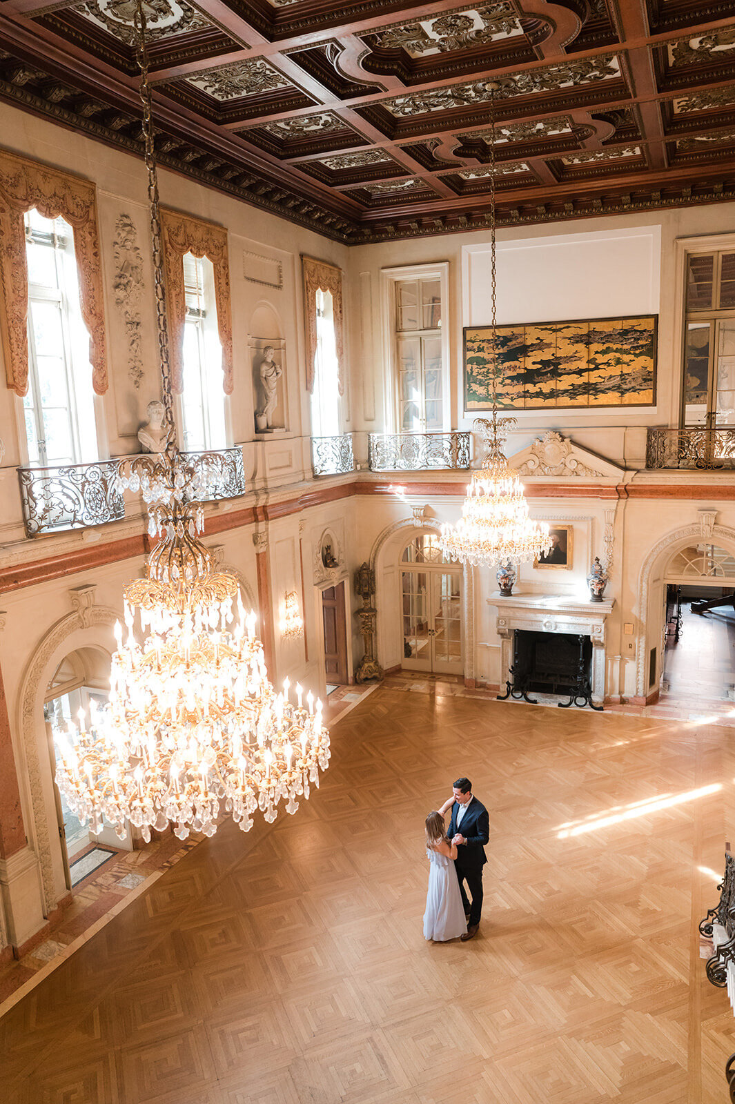 Engaged couple dancing in the grand ballroom of Larz Anderson House during elegant Washington DC engagement session.1
