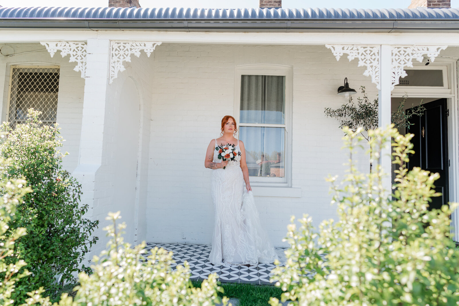 Bride staNIDNG IN THE DOOR READY TO HEAD OFF TO HER WEDDING DAY