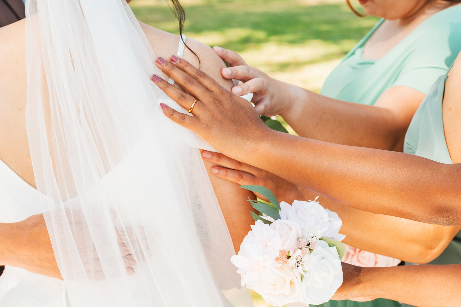 Bridesmaids pray for the bride before her wedding.