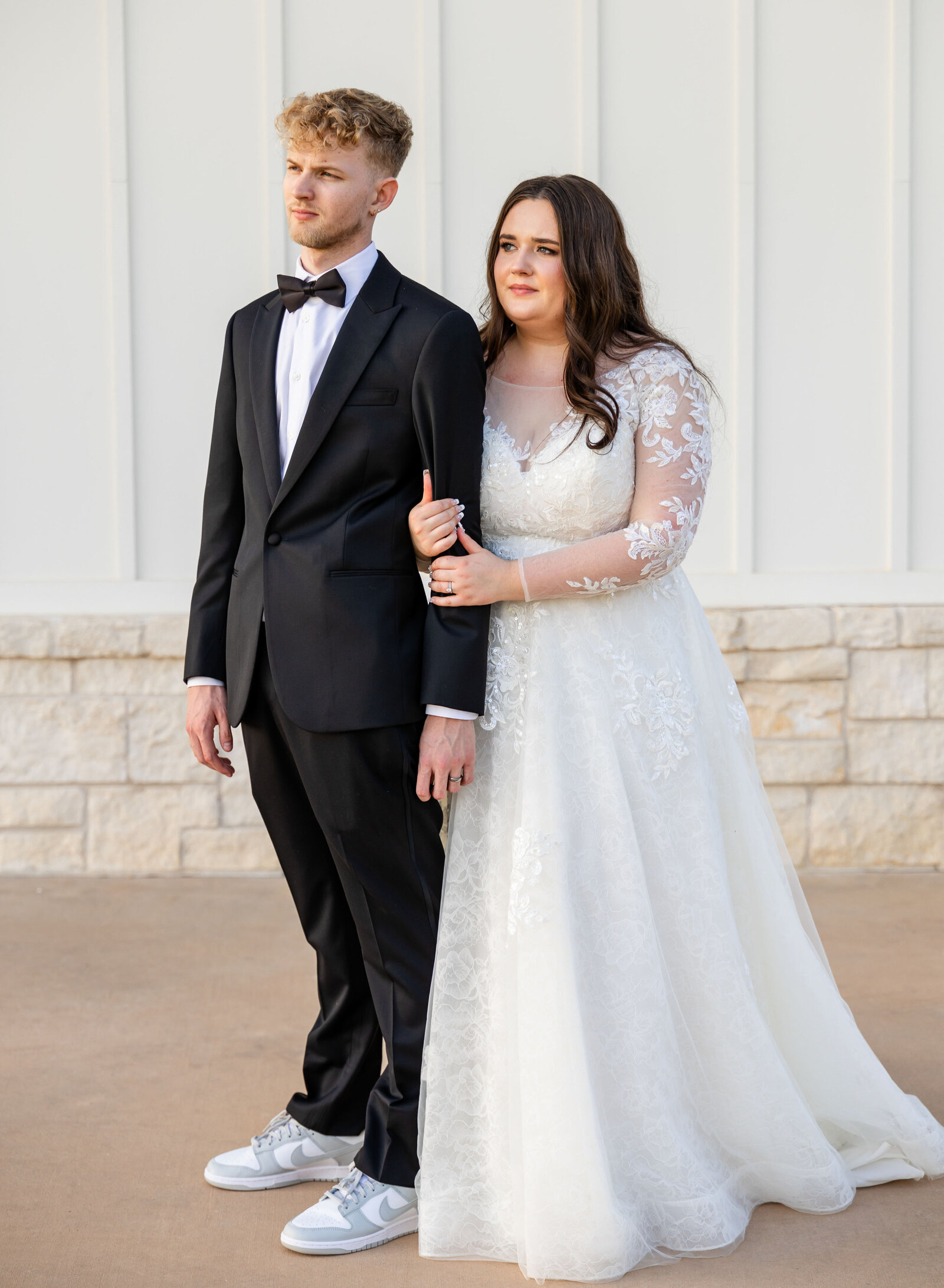 classy bride and groom looking into the distance