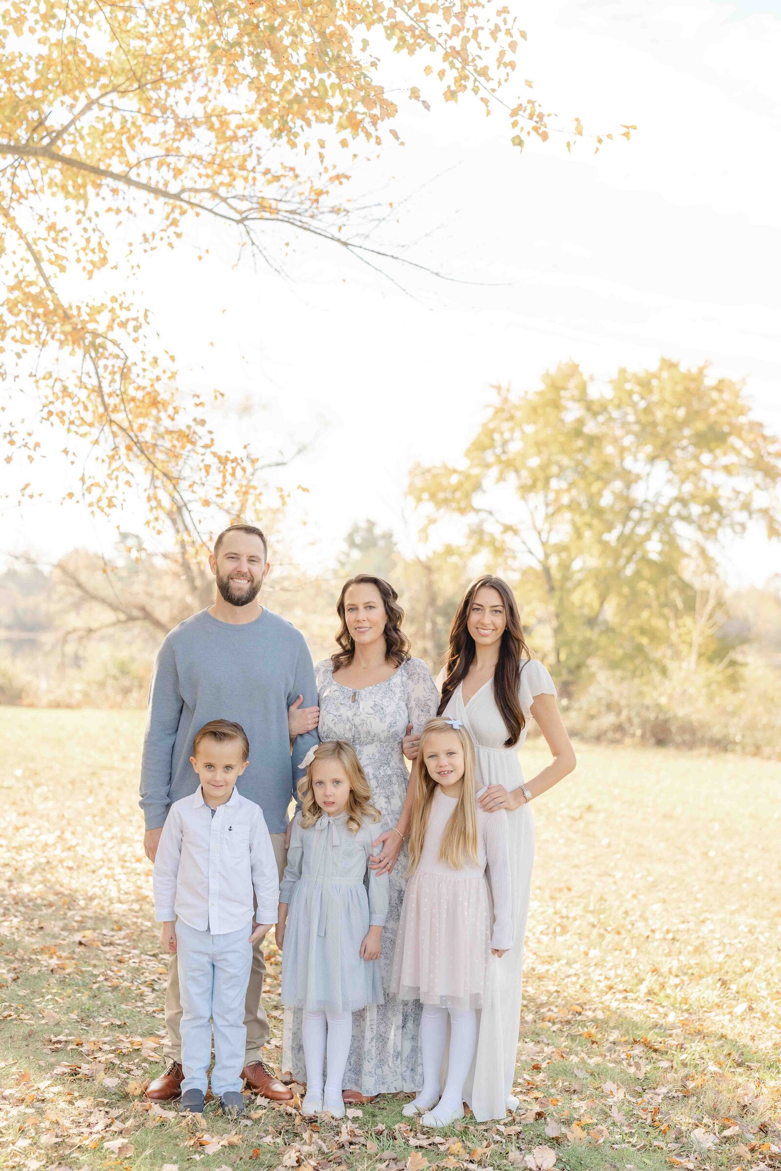 family posing for photo