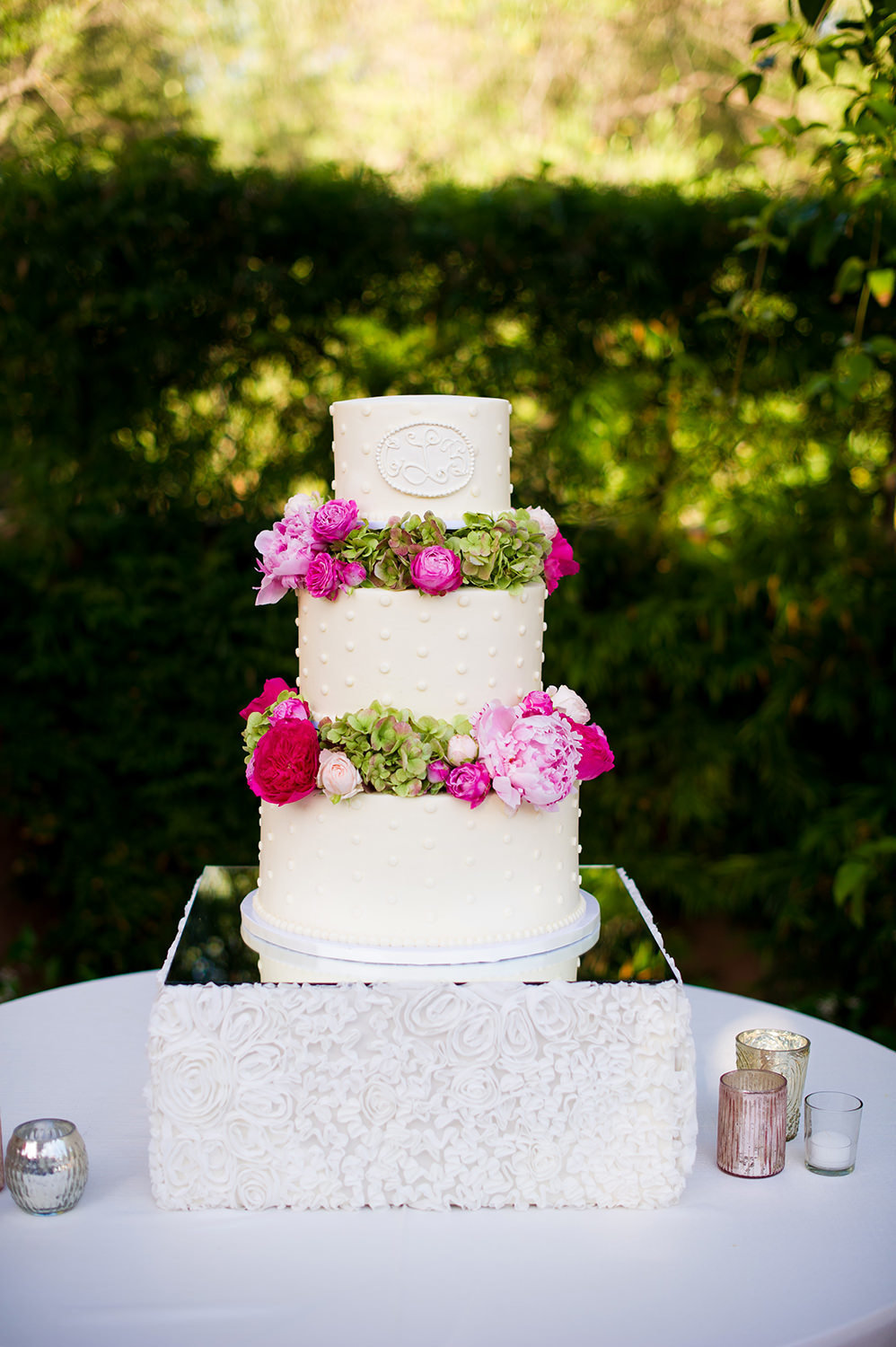 Tiered wedding cake with floral decorations