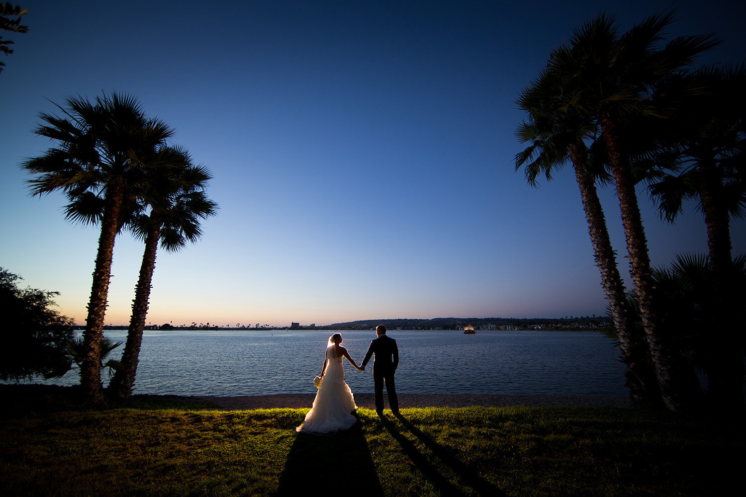 Dramatic portrait of bride and groom after sunset at Paradise Point