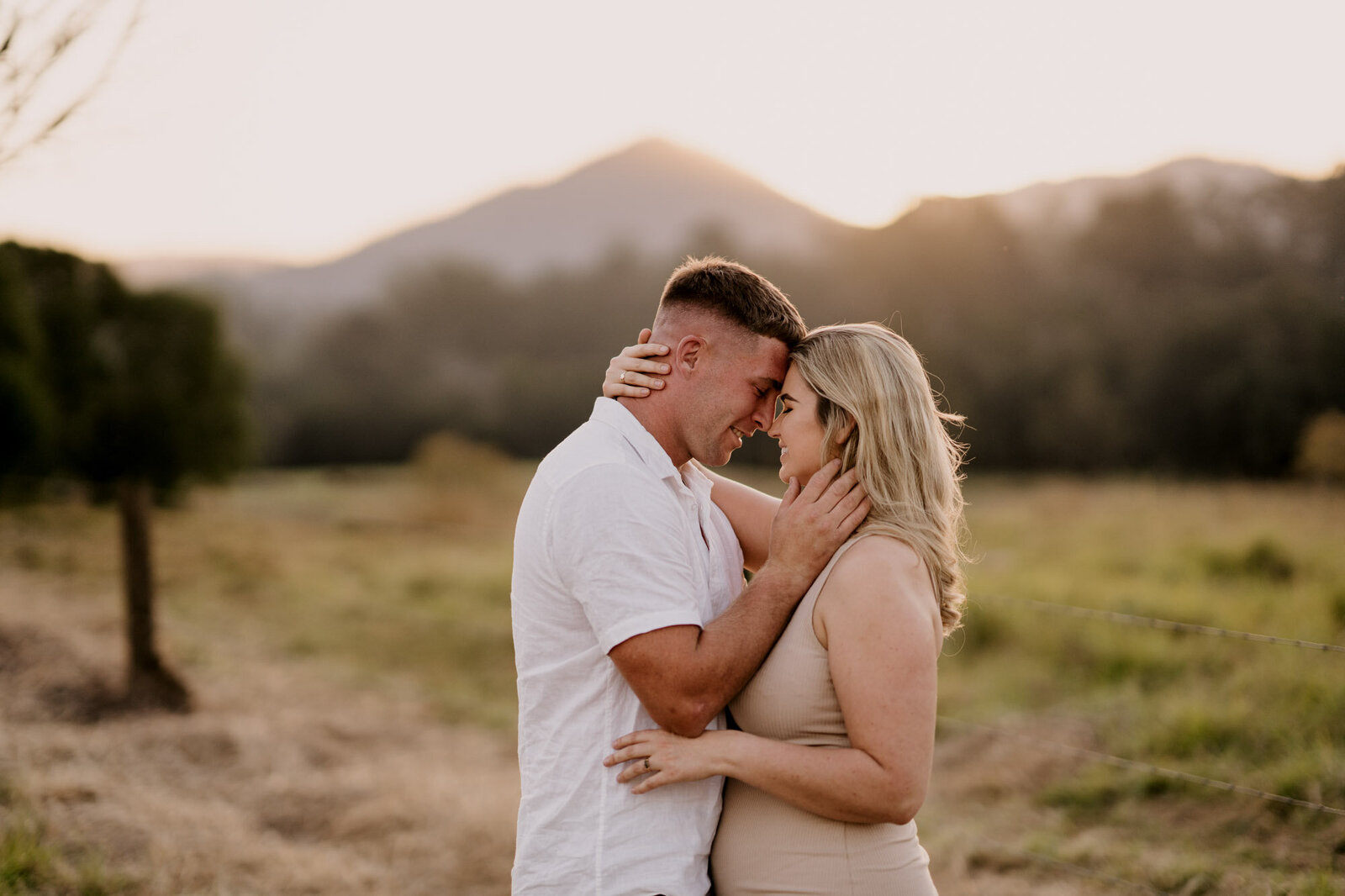 engaged couple with mountain background