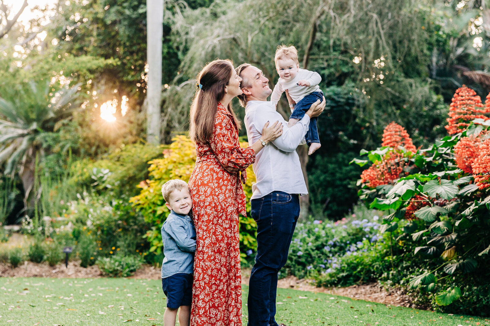 Candid photo of a family iwth two young boys at sunken gardens taken by family photographer Alison Amick