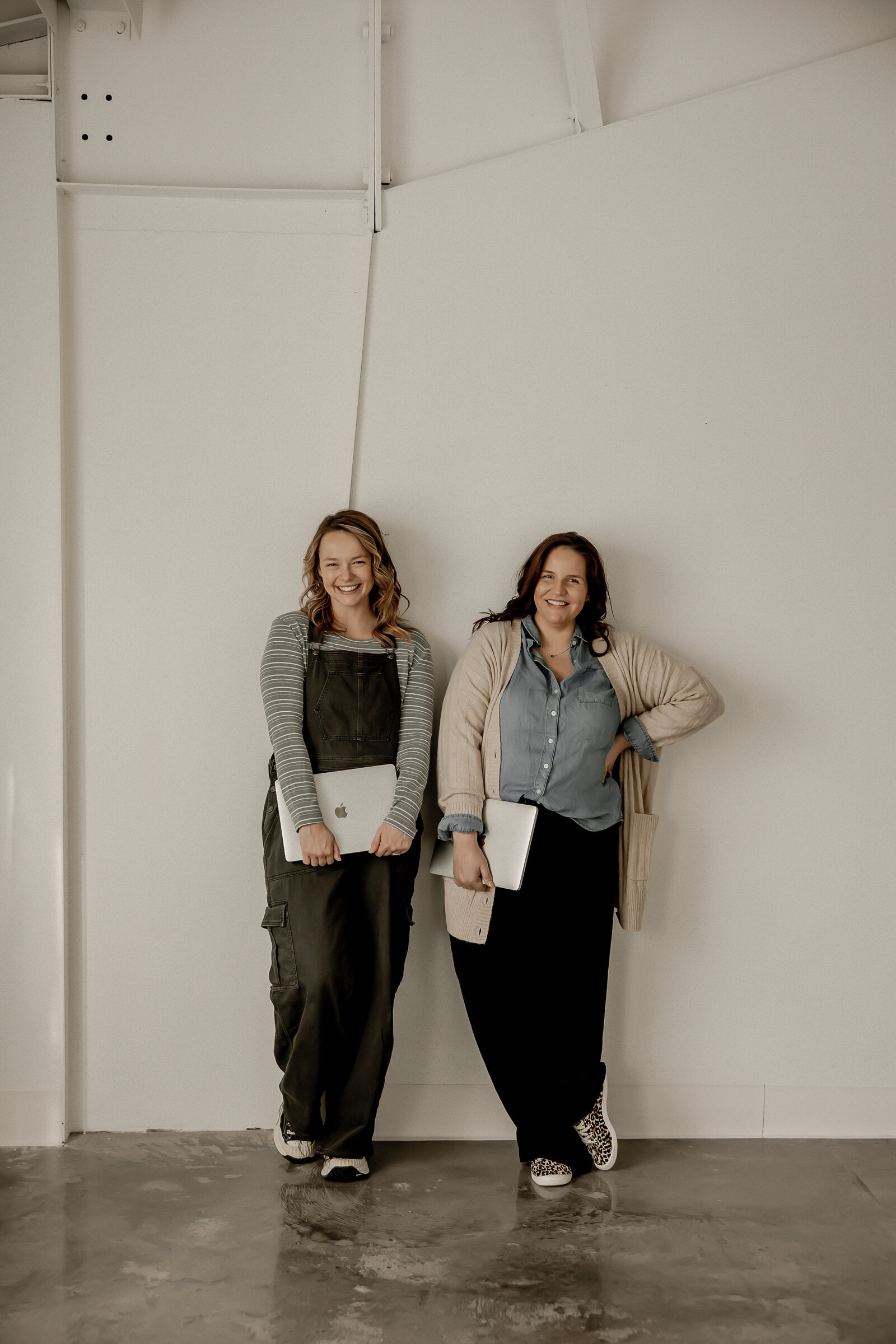 Lacey and Amber standing side by side smilling