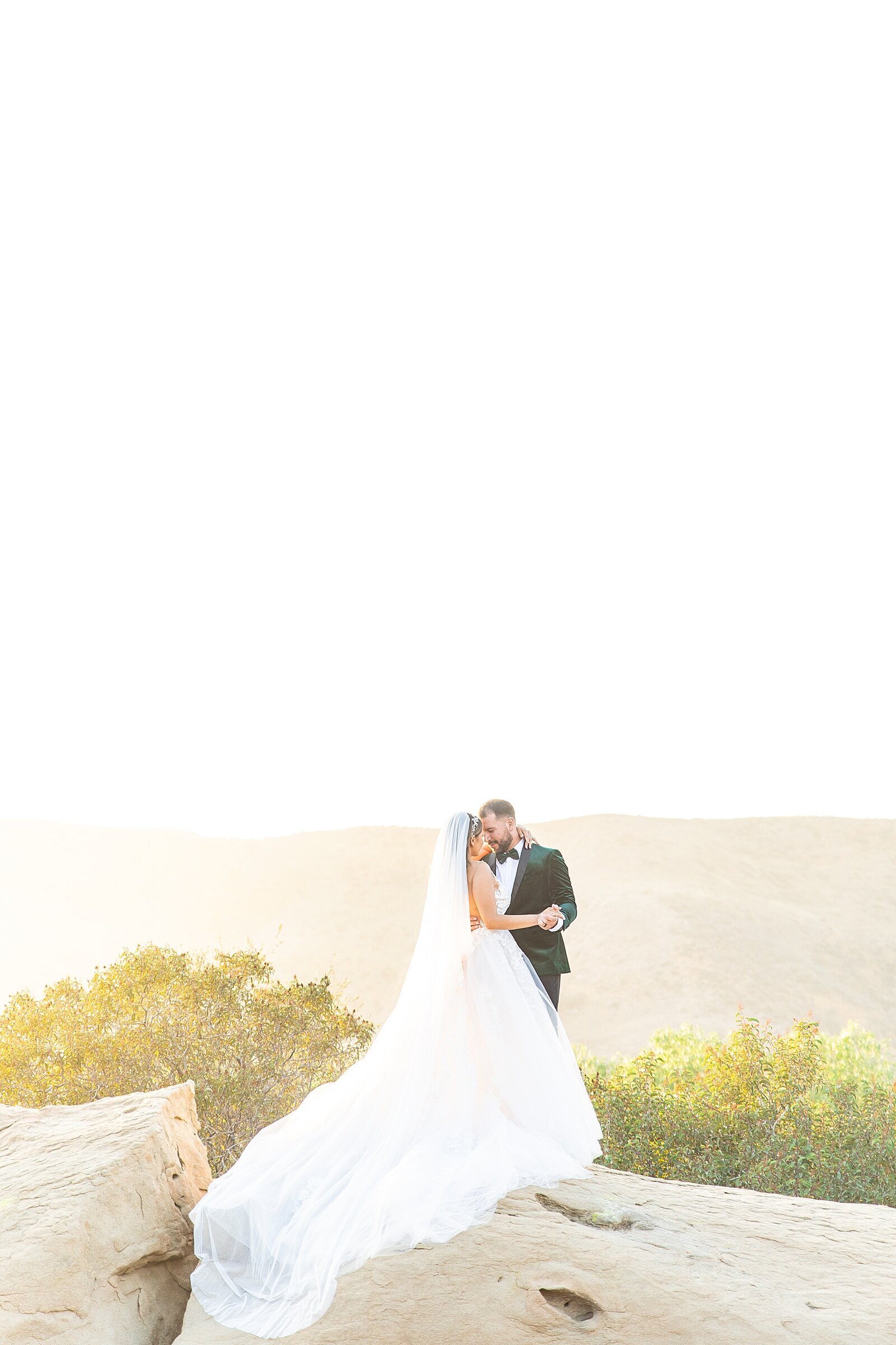Bride and groom on a mountaintop in Los Angeles, California.