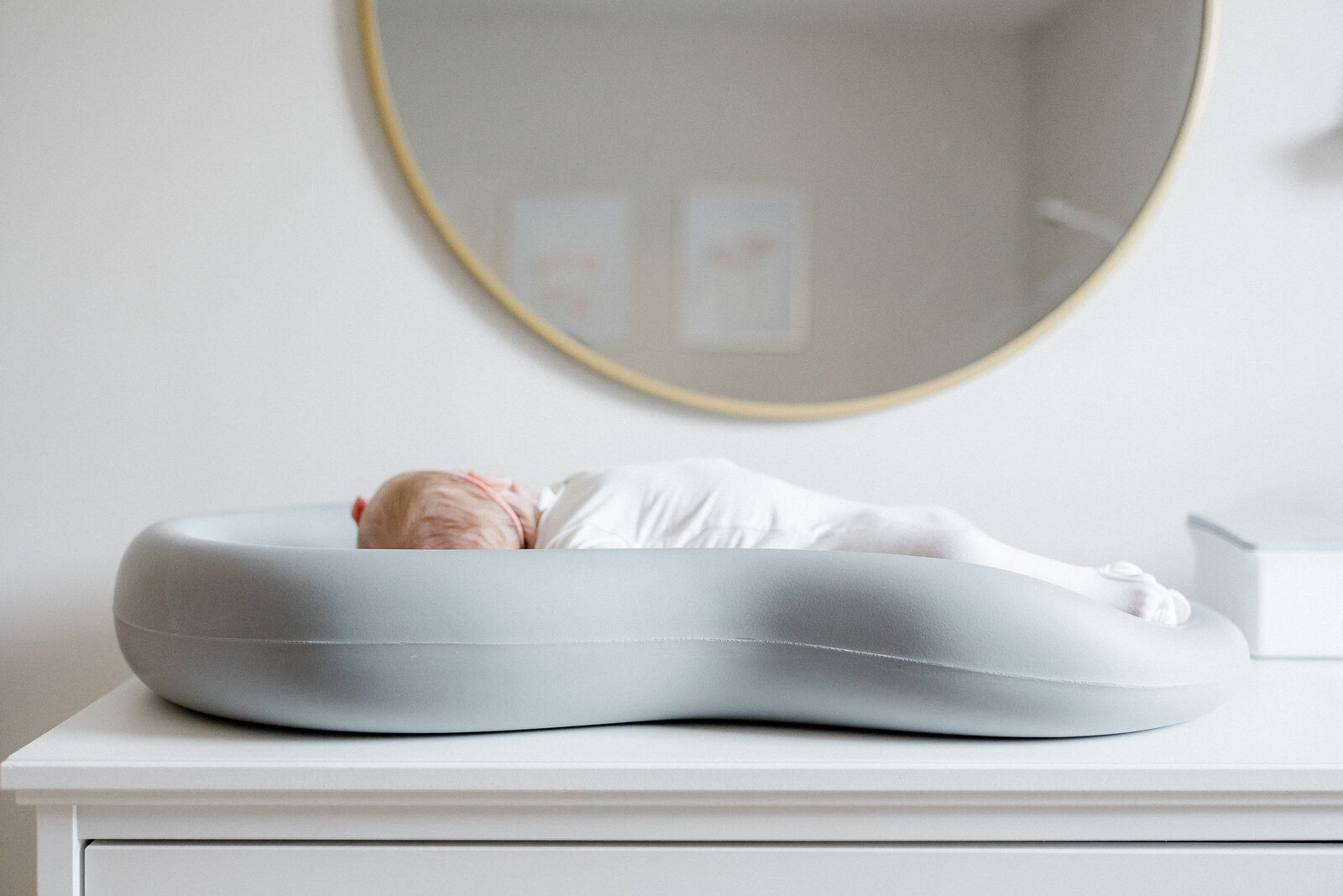 photo of baby laying on changing table