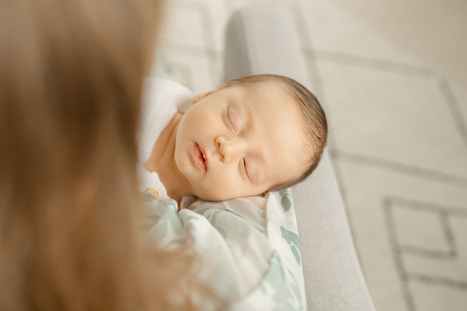 baby boy sleeping held by mom during newborn photo Haymarket, Virginia