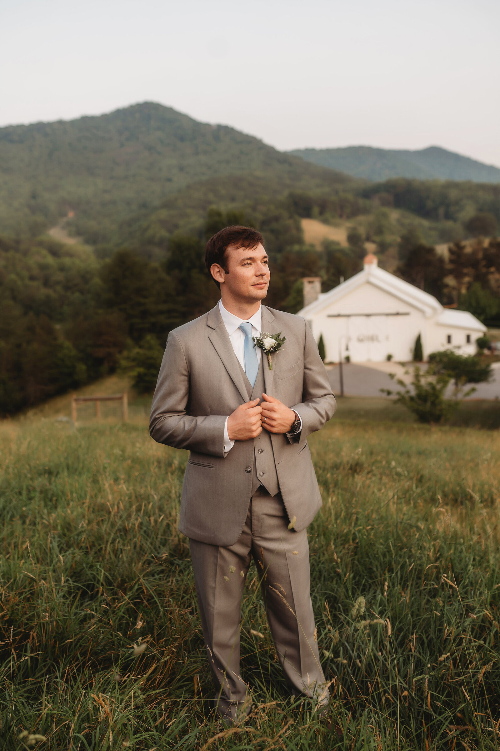 Groom poses for Wedding Photos at Chestnut Ridge Events in Asheville, NC.