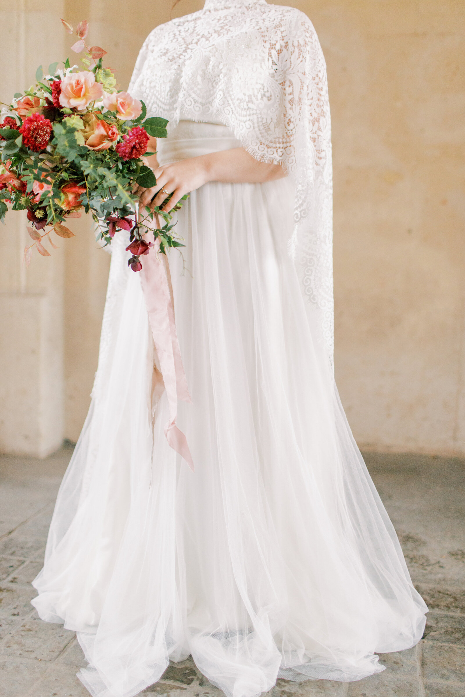 bride holding bouquet of flowers in paris, france