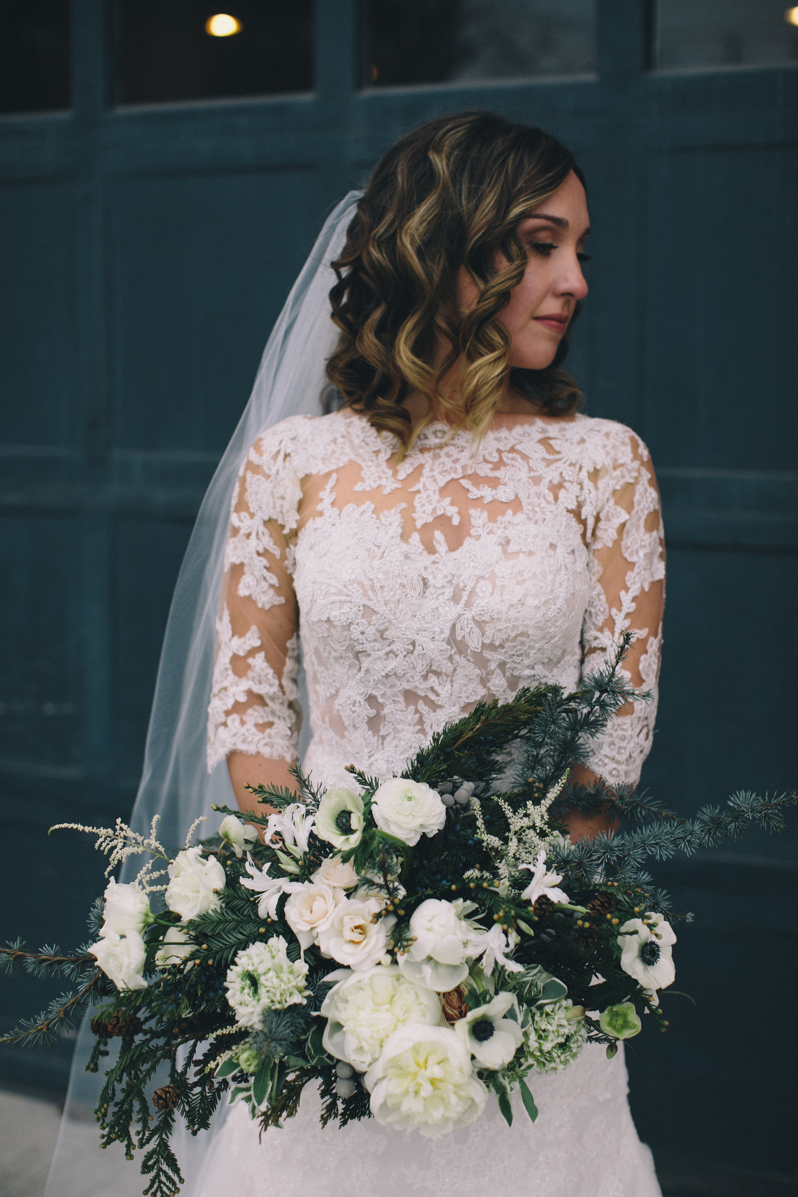 beautiful-winter-bridal-bouquet-portrait-evergreens