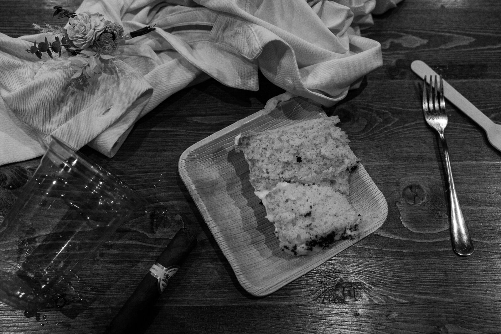 The black and white image of the late night flat lay after the reception 