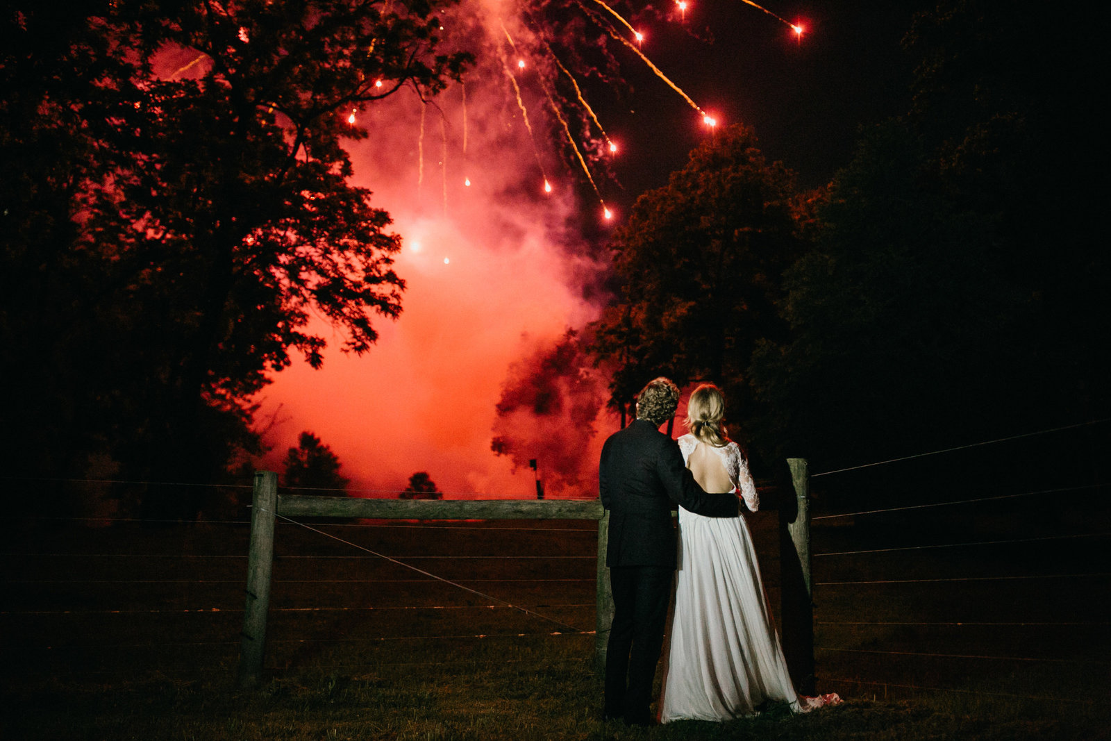 Bride and groom enjoy fireworks together at their reception on this family estate.