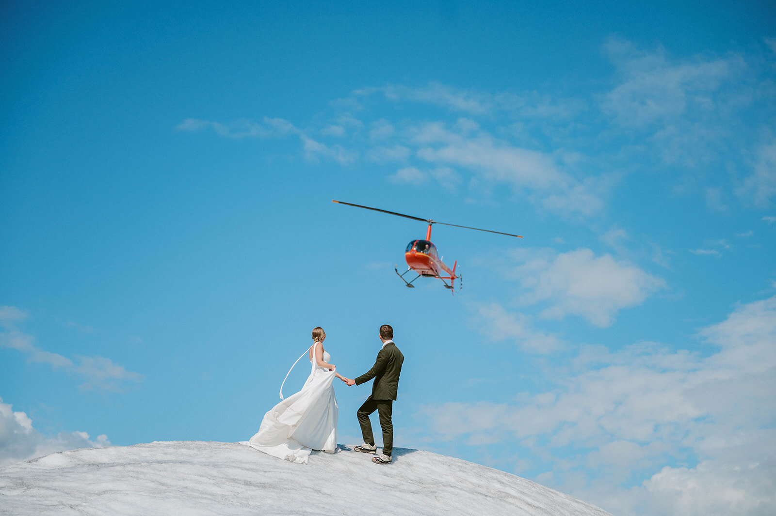 Couple with helicopter fly over
