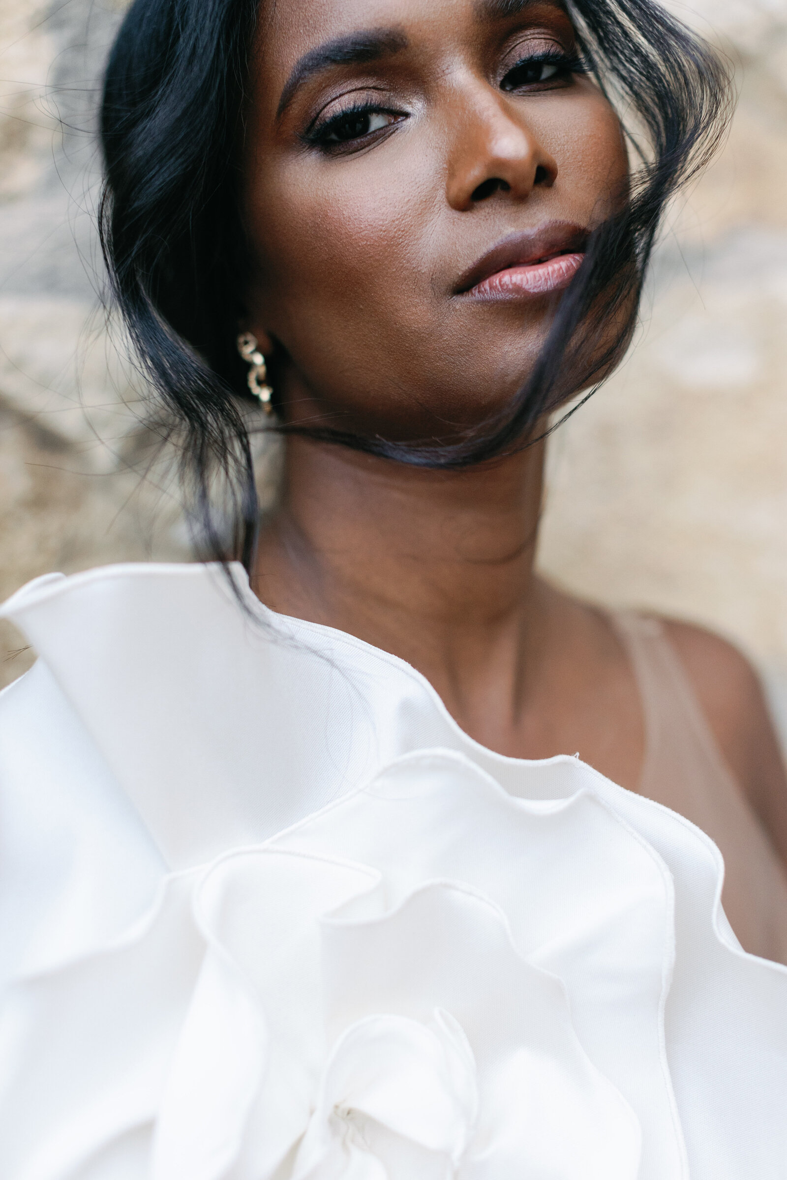 A black bride with soft smoky eyes and neutral lips at Sunstone Winery wedding