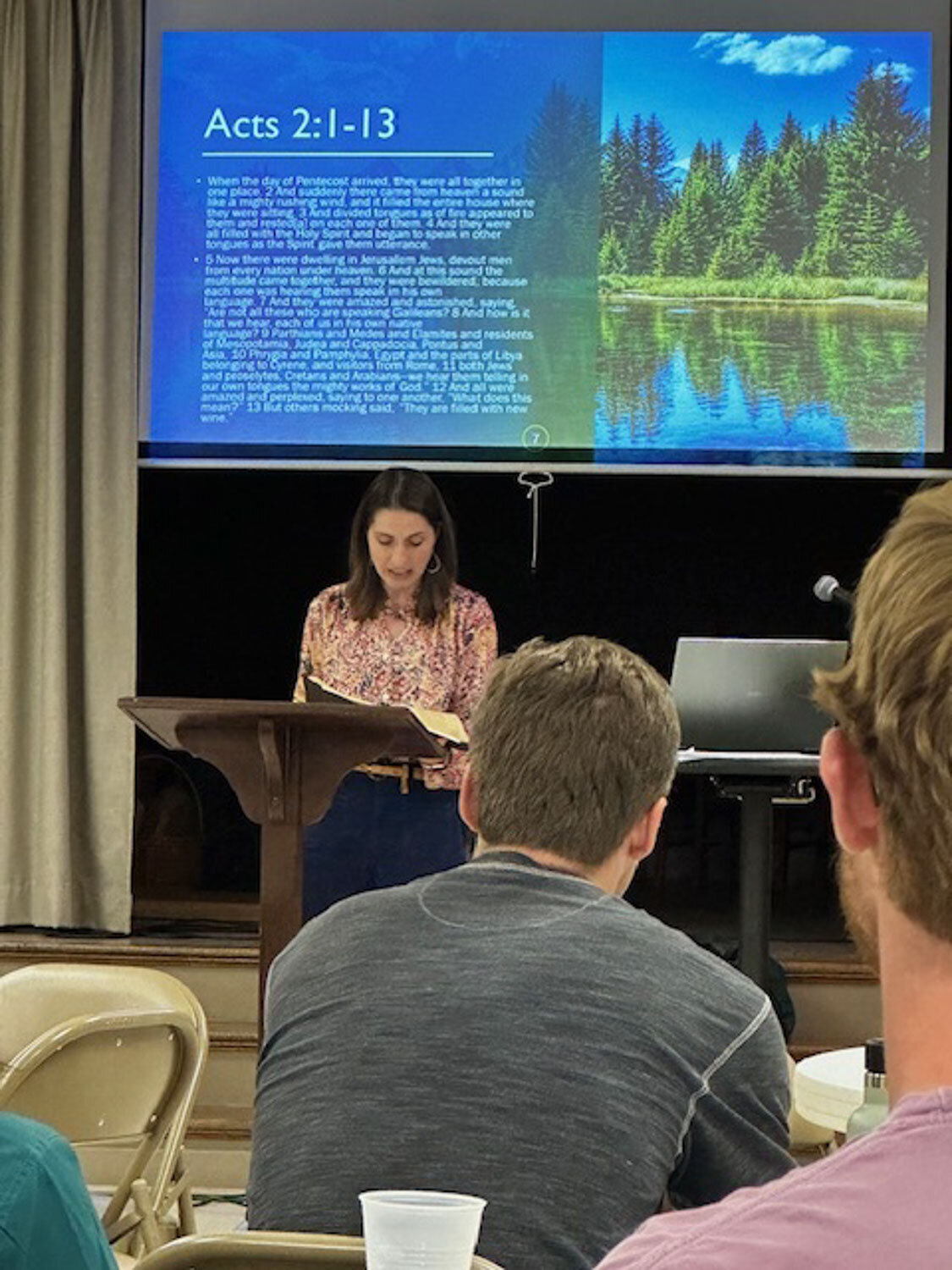 woman giving presentation in front of group