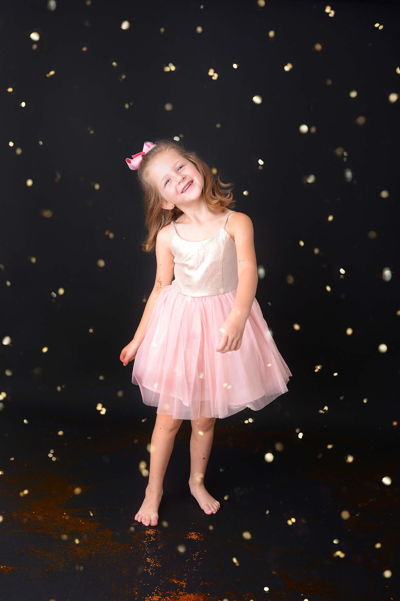 girl has fun at her glitter photo session in houston