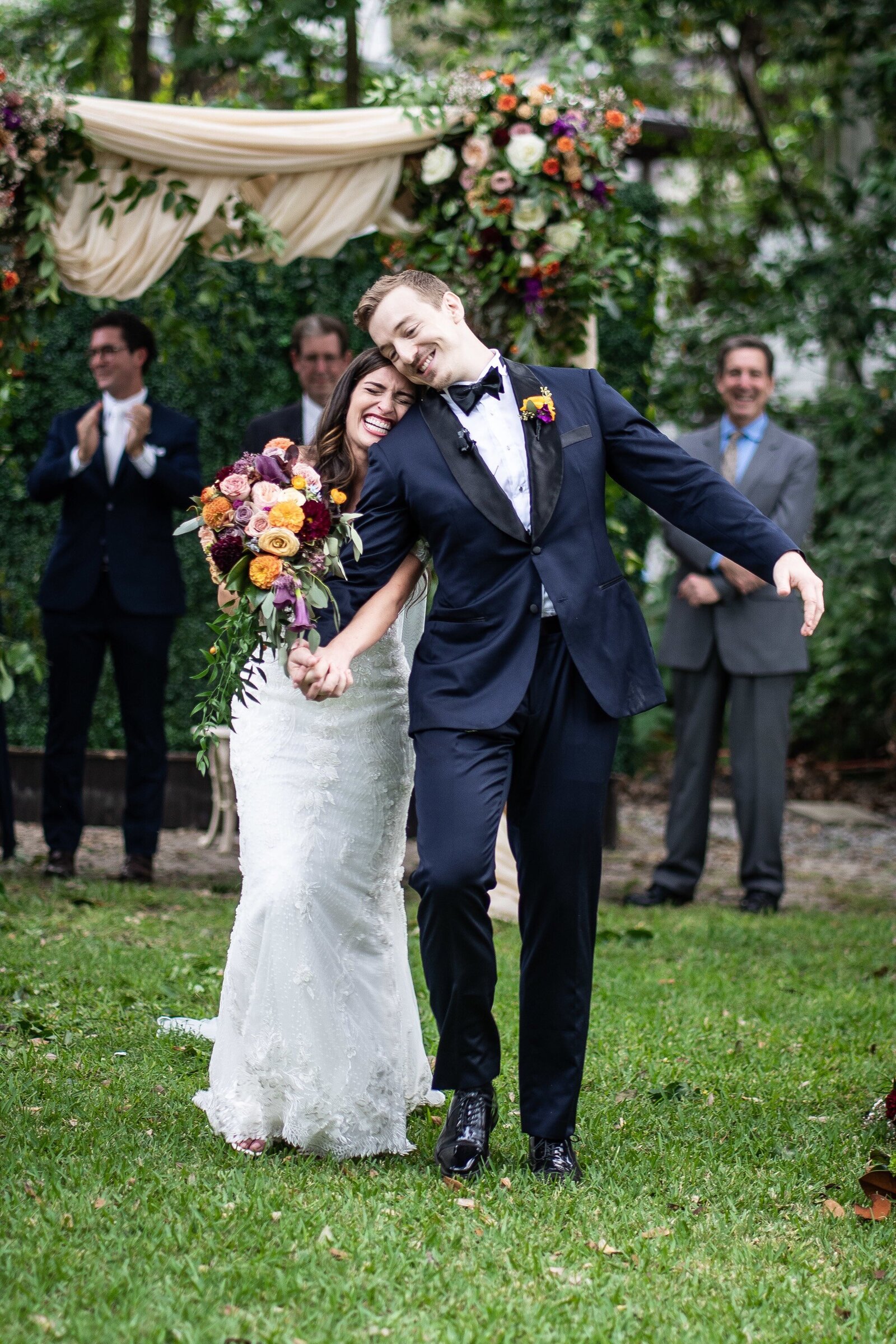 Bride and groom walk down aisle at Elms Mansion wedding in New Orleans