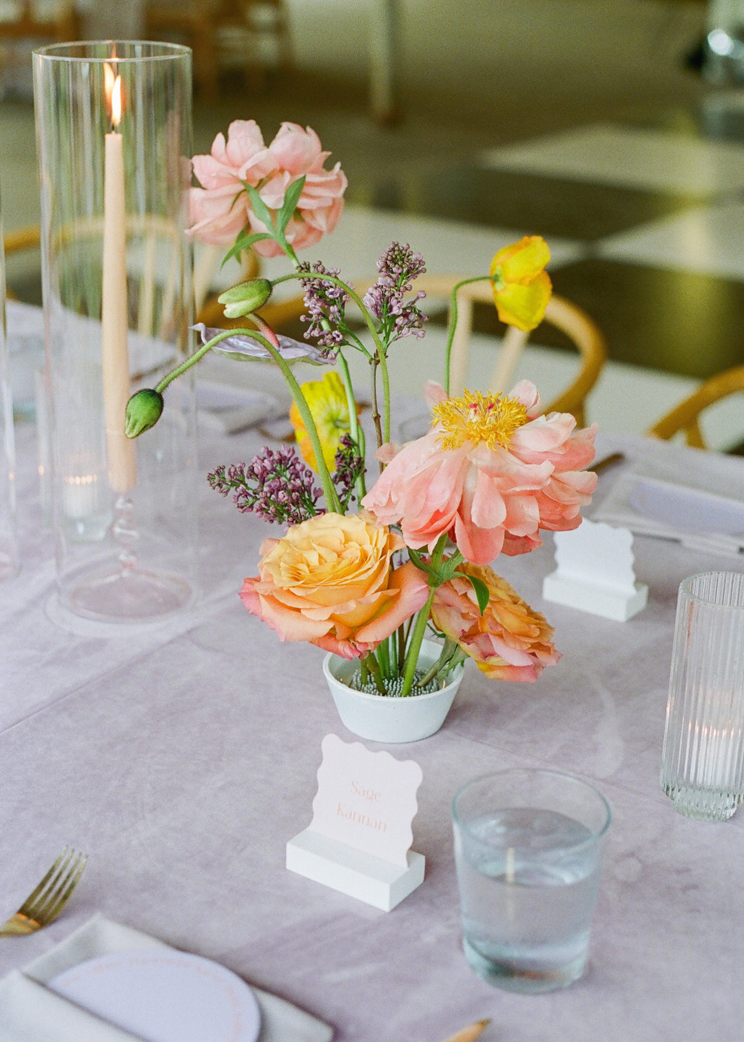 Colorful floral centerpiece on wedding reception table