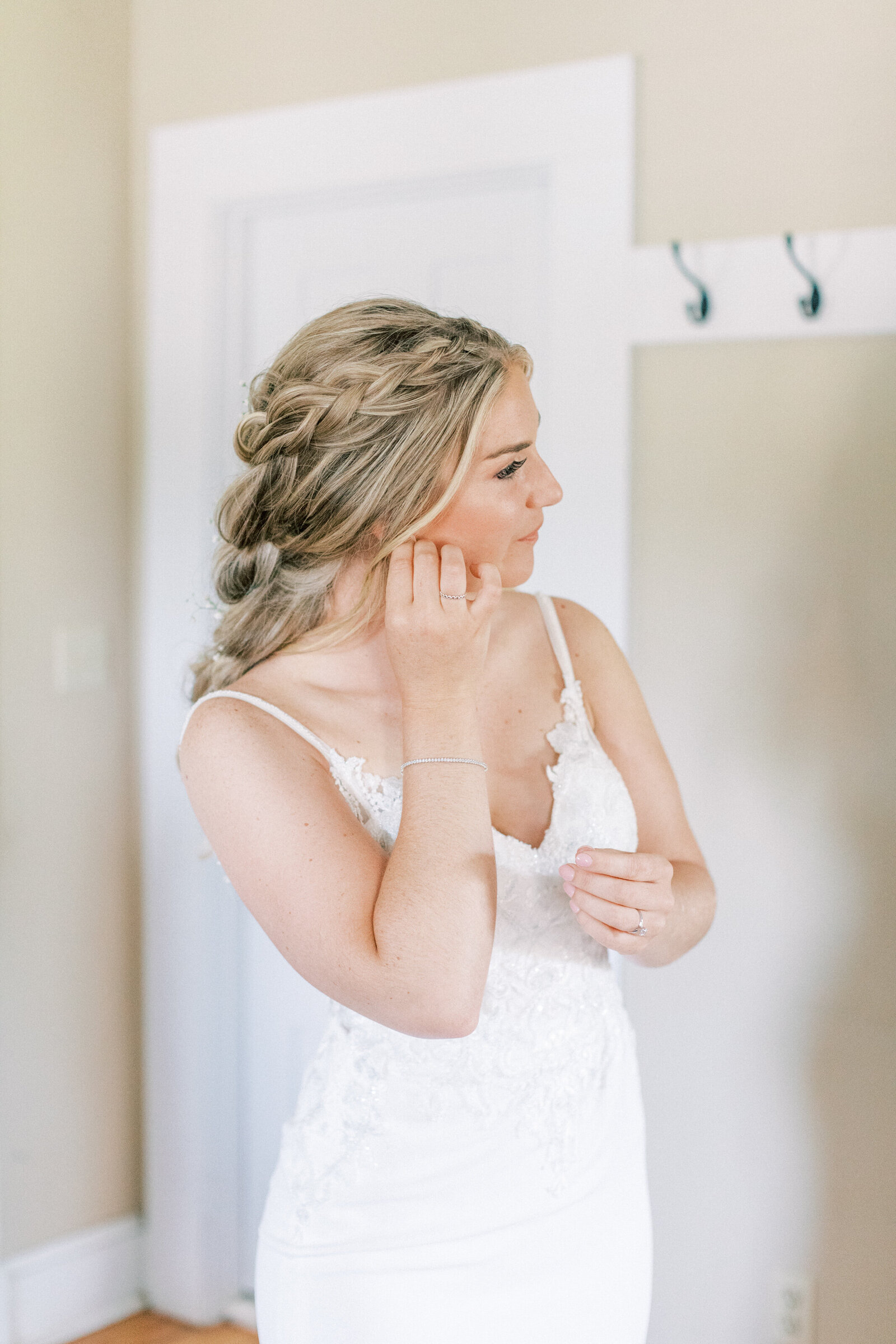 Bride puts in her earrings