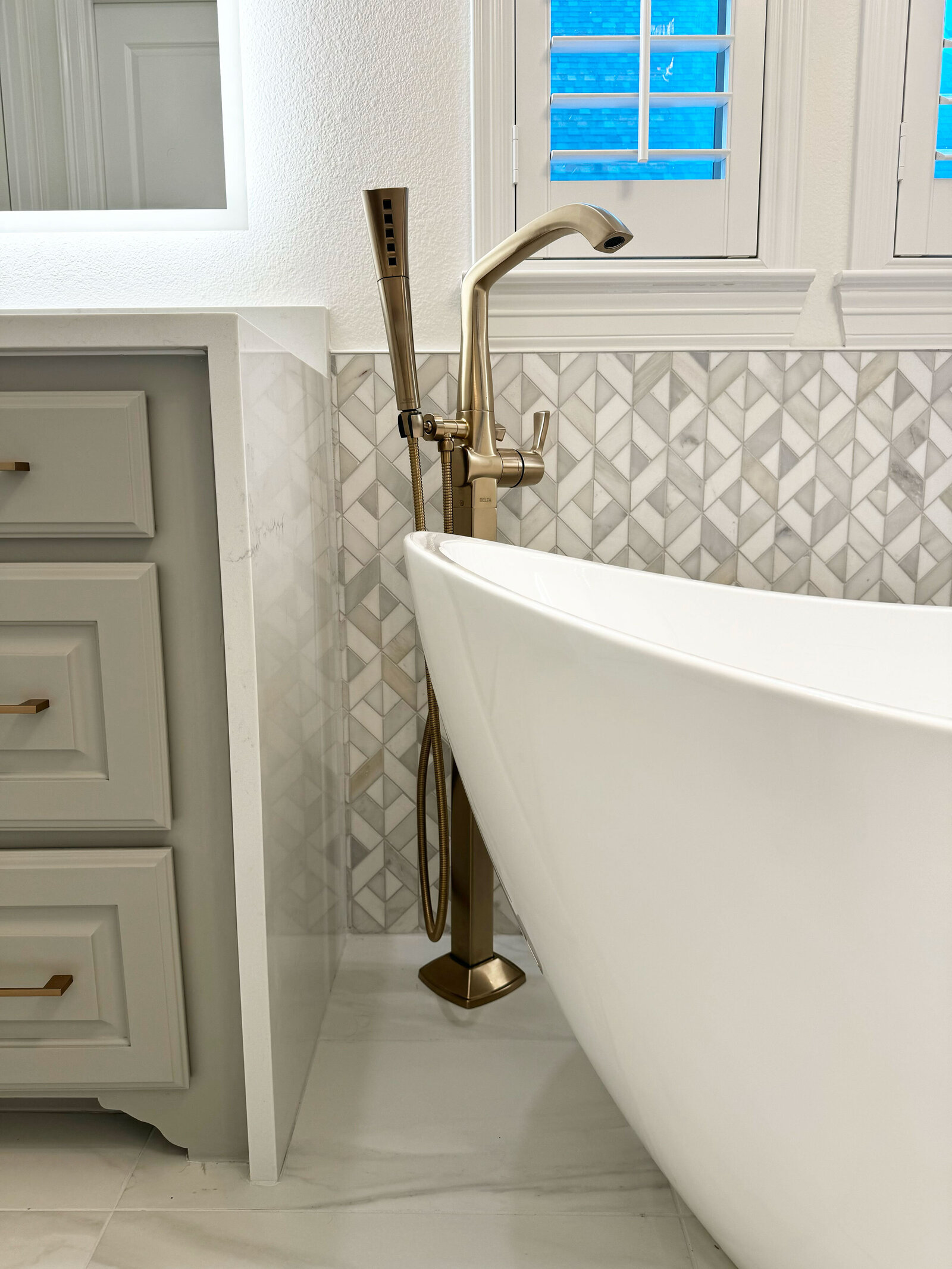 Experienced home renovation designer working on a detailed blueprint for a modern kitchen remodel, highlighting innovative design solutions and quality materials.